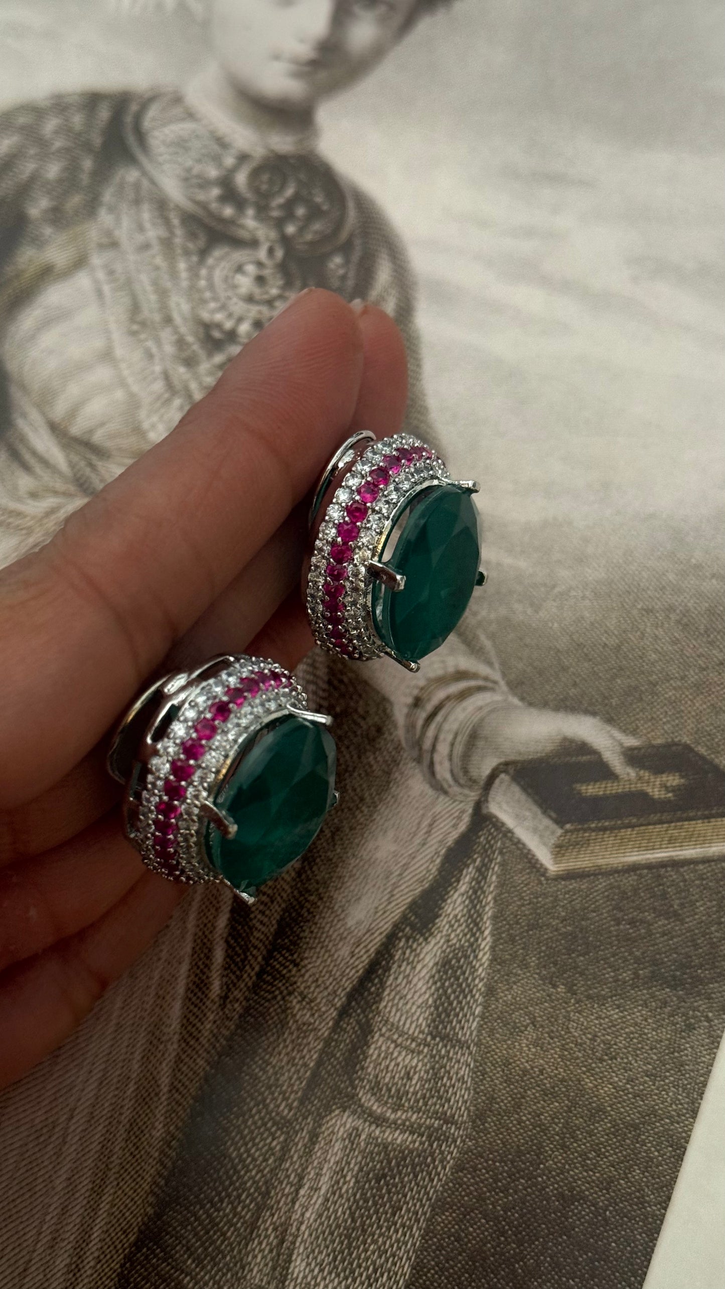 Emerald studs with ruby lining (Silver polish)