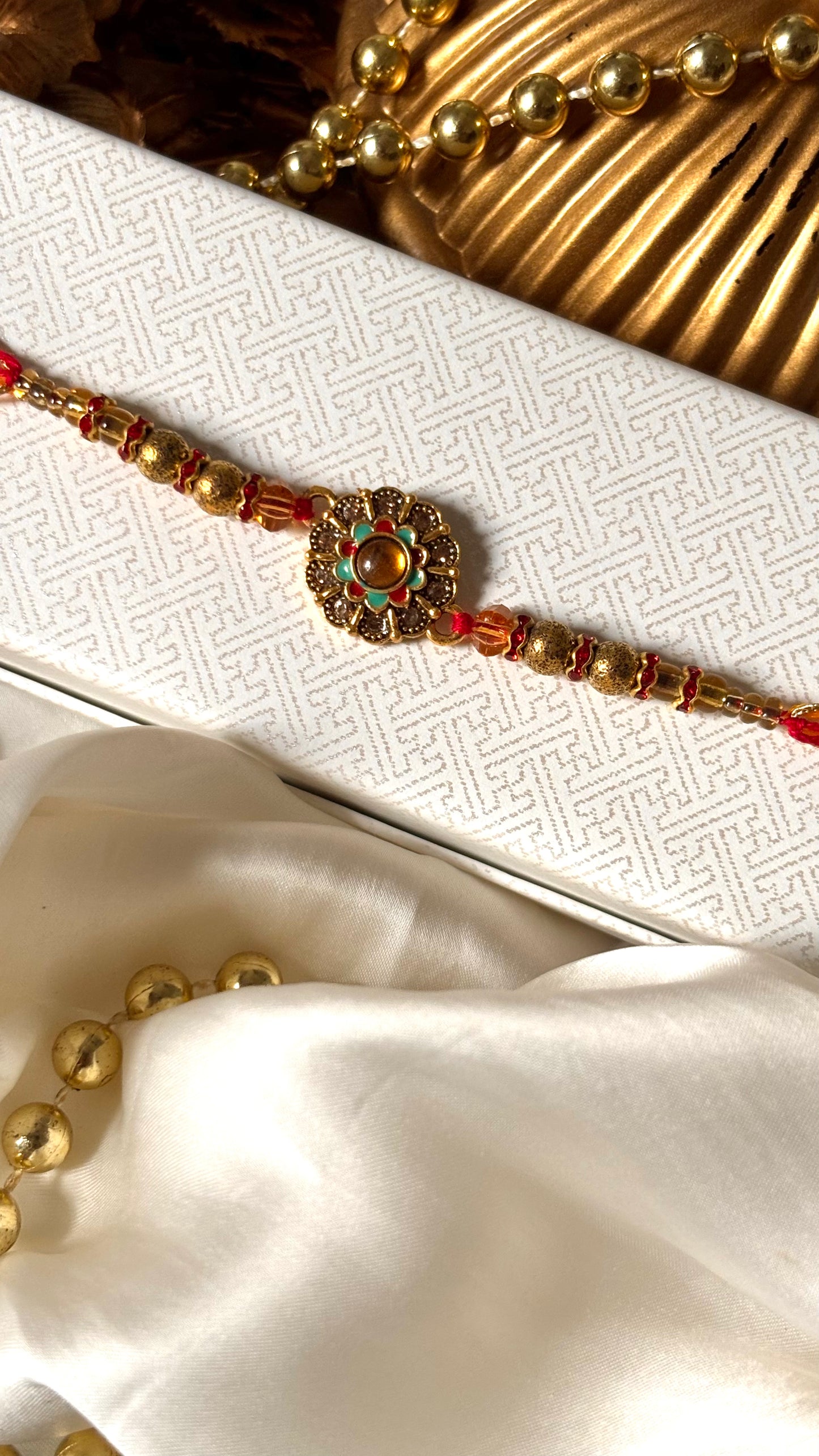 Floral hand painted nakashi oxidised gold Rakhi ( shipping will be extra )