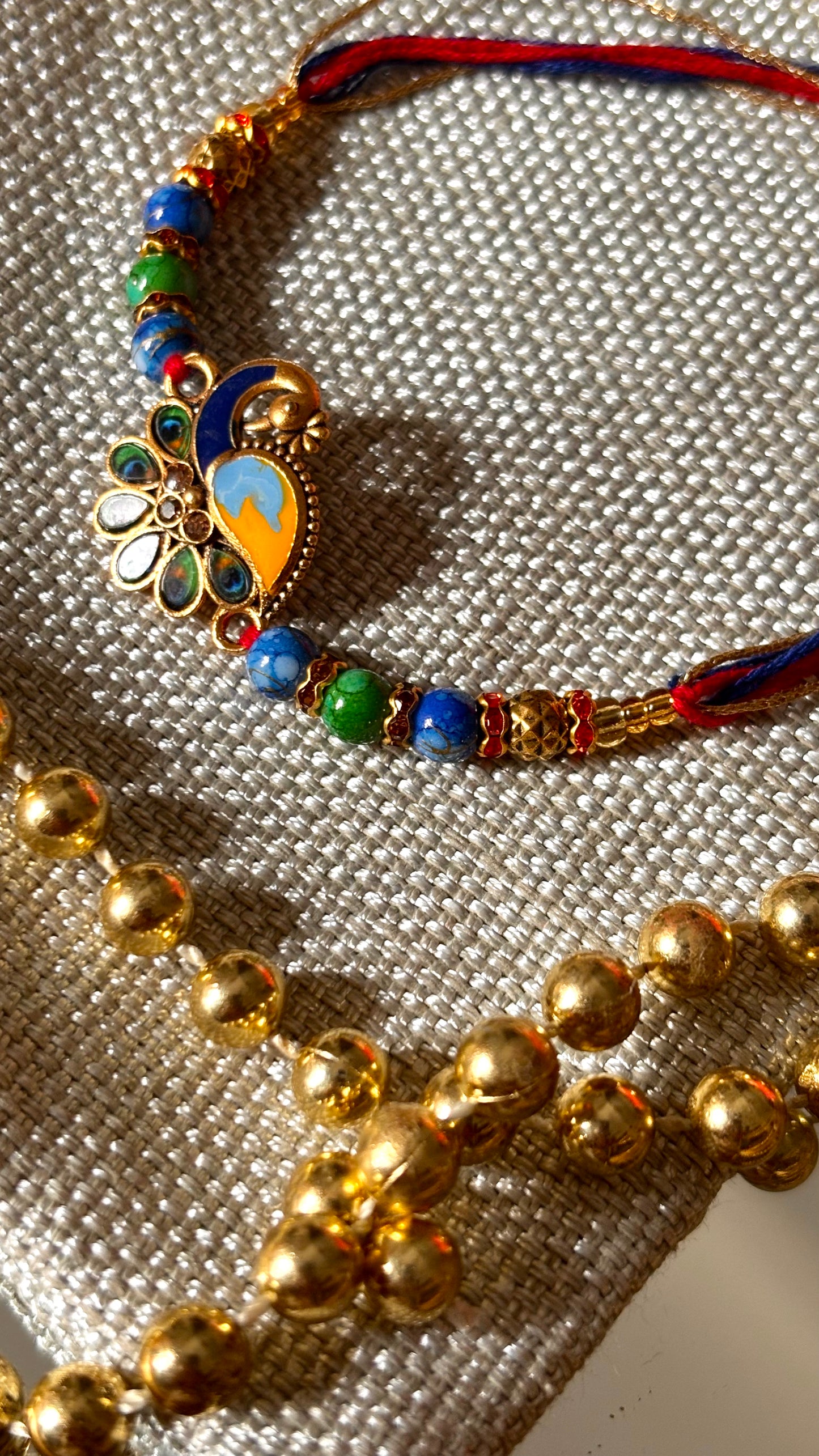 Peacock designer minimalist rakhi ( shipping will be extra )