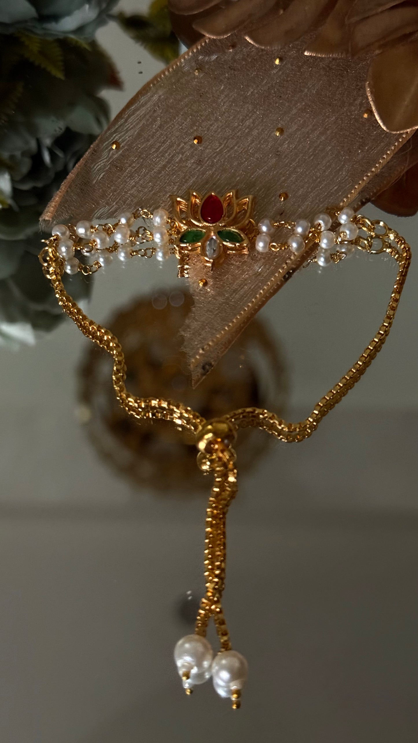 Ruby & emerald lotus inspired Rakhi (shipping will be extra )