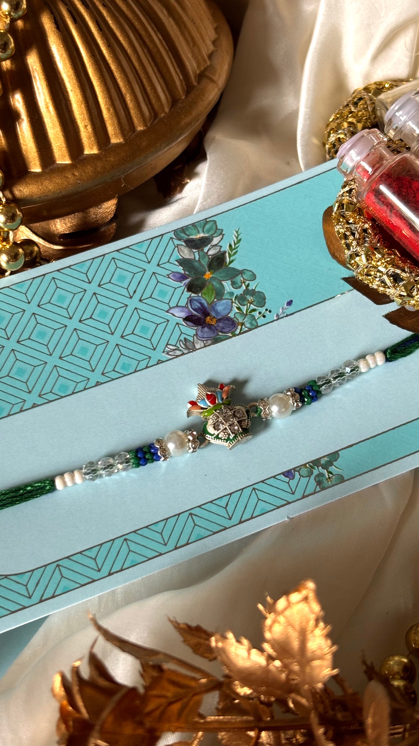 Kalash with pearl detailing rakhi ( shipping will be extra )