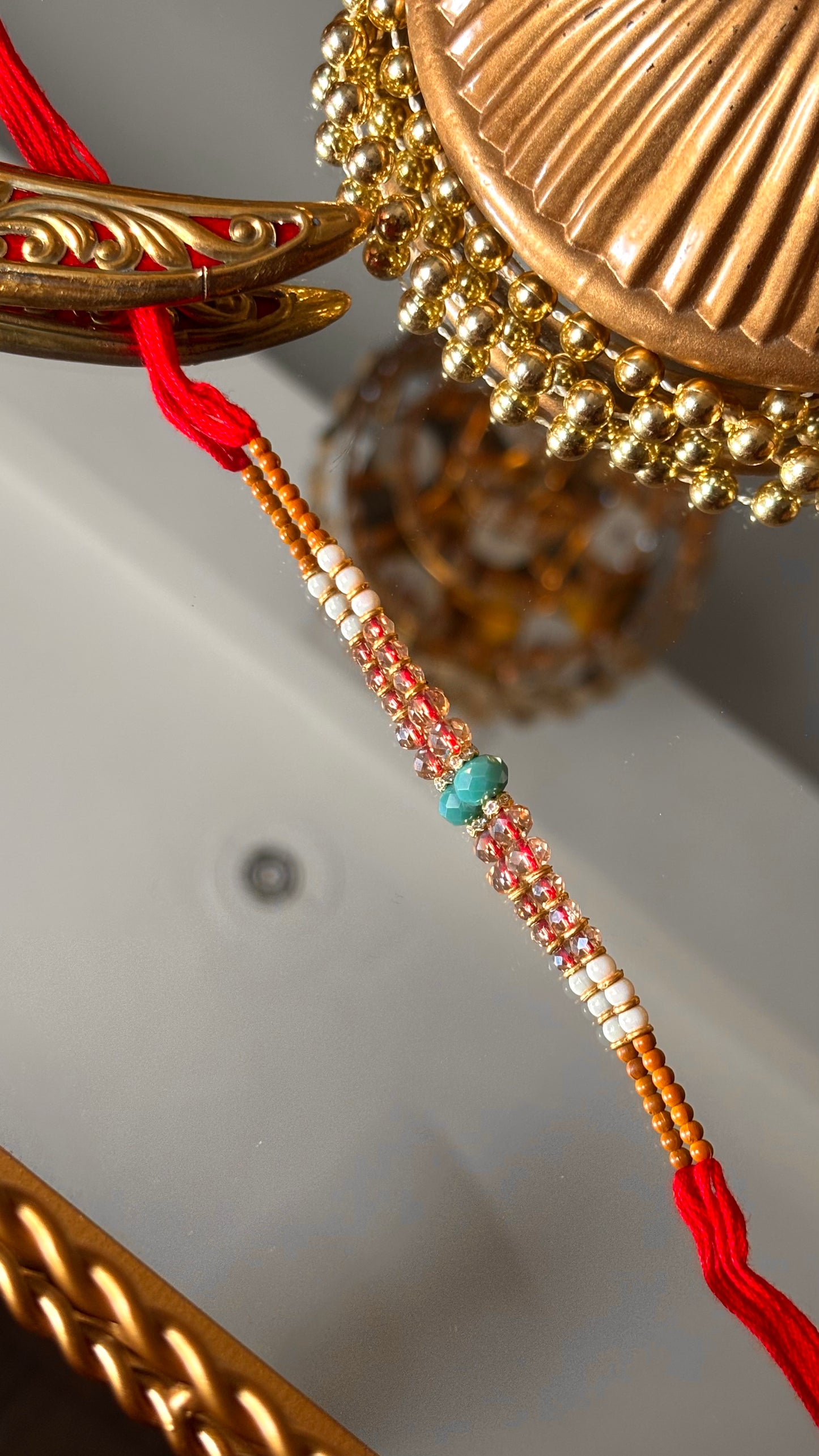 Firoza thread rakhi (shipping will be extra )