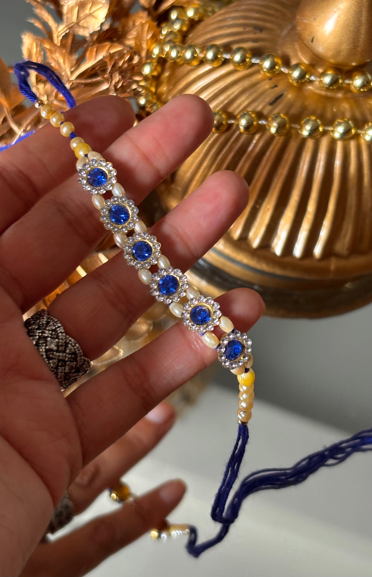 Sapphire stone rakhi ( shipping will be extra )