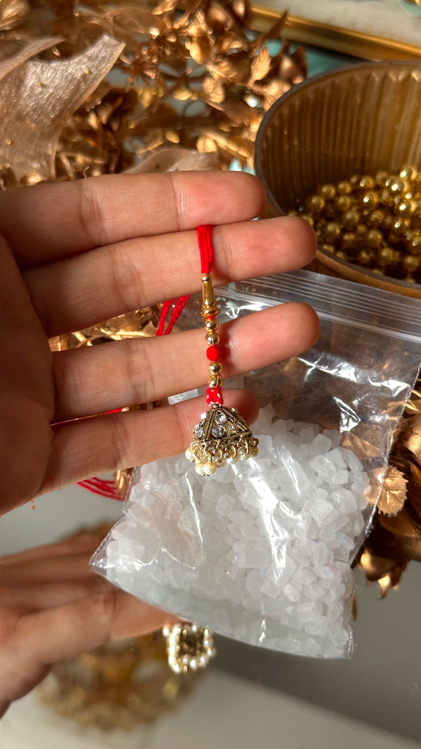 Gold jhumki rakhi