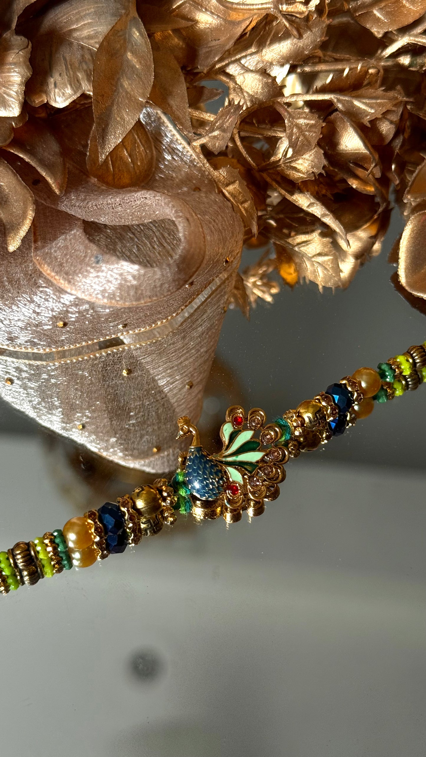 Peacock inspired nakashi rakhi