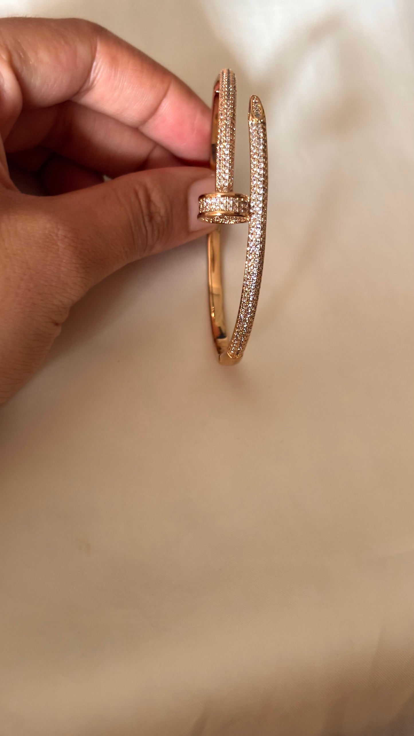 Crystal-Accented Nail rose gold tone bracelet