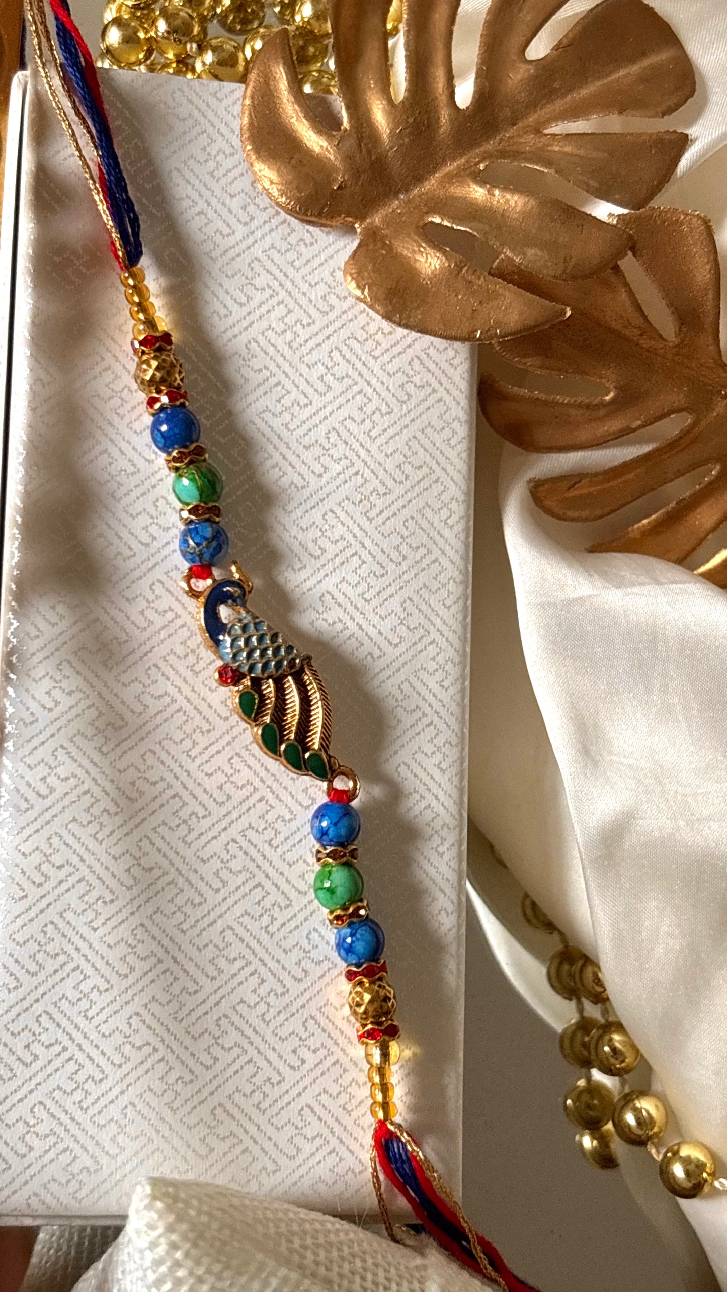Peacock designer minimalist rakhi ( shipping will be extra )