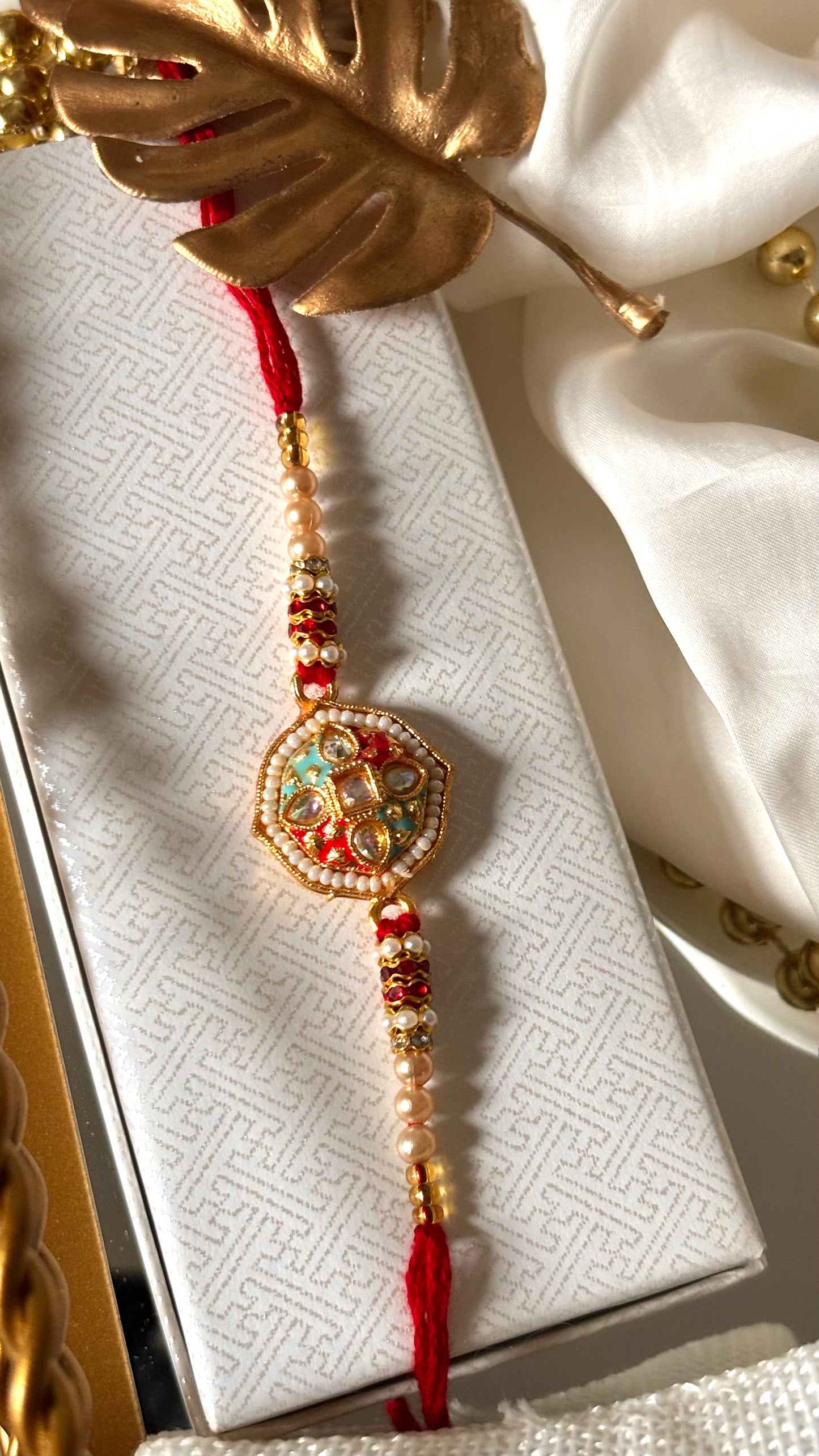 Red & firoza meenakari Kundan designer Rakhi ( shipping will be extra )