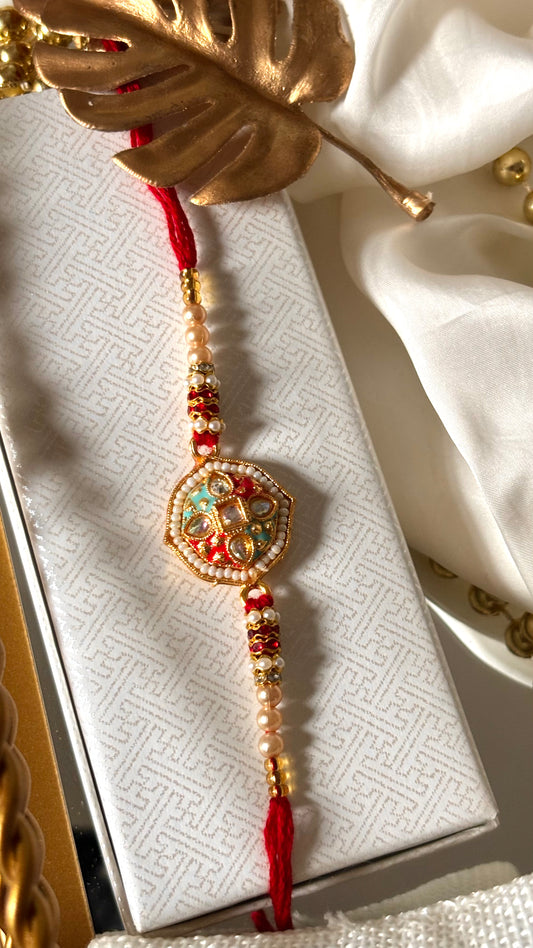 Red & firoza meenakari Kundan designer Rakhi ( shipping will be extra )