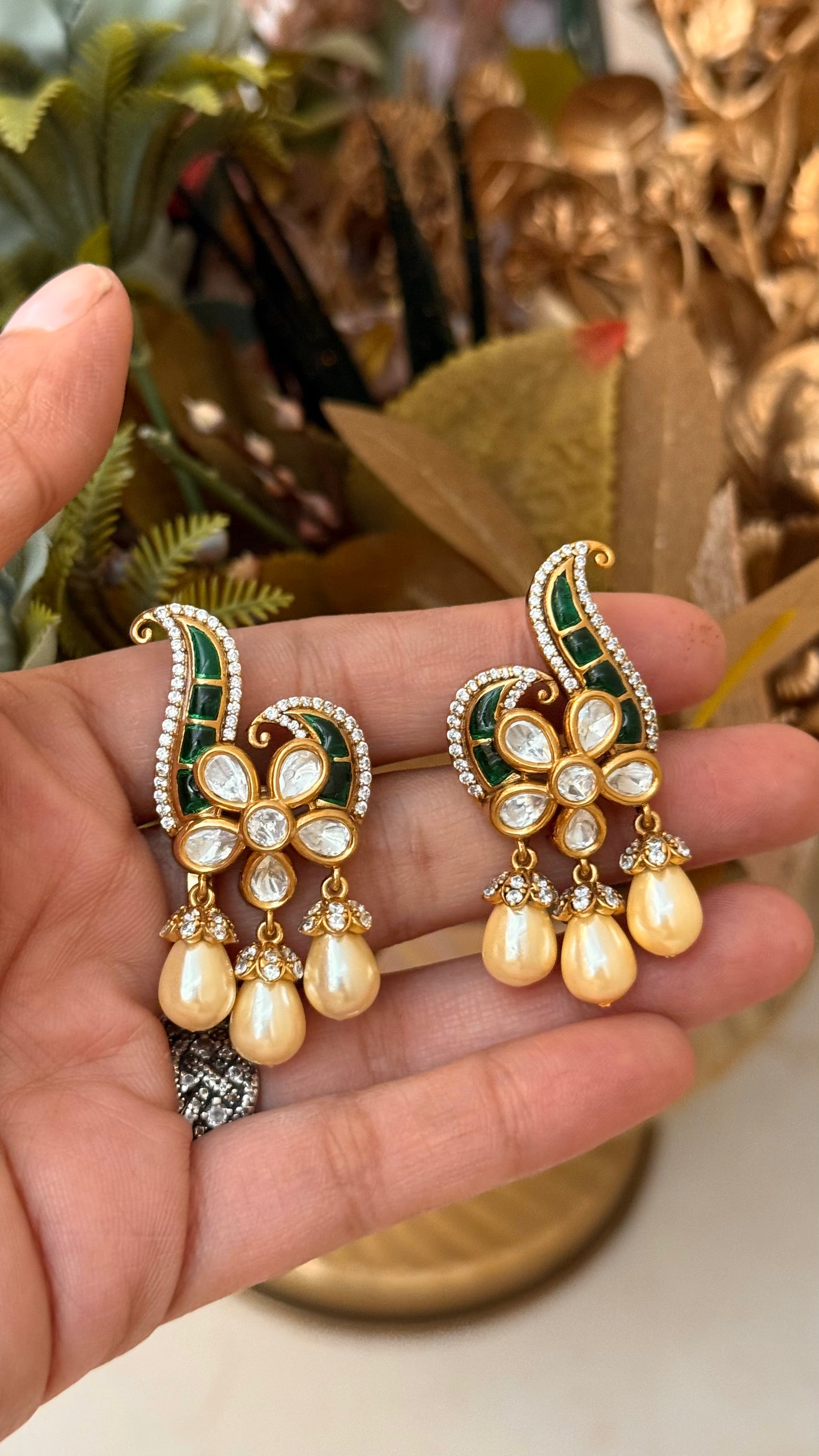 Designer emerald takkar studs with floral pearl detailing