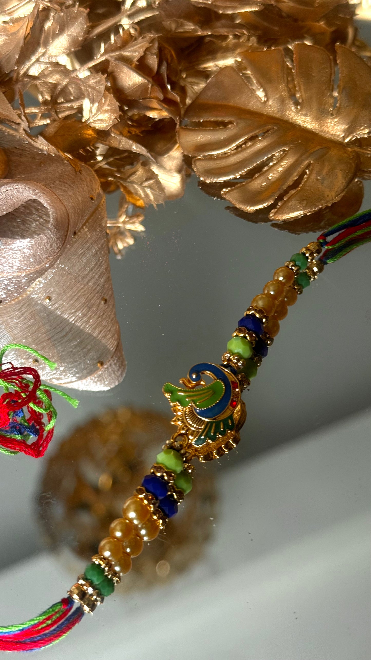 Peacock inspired nakashi rakhi
