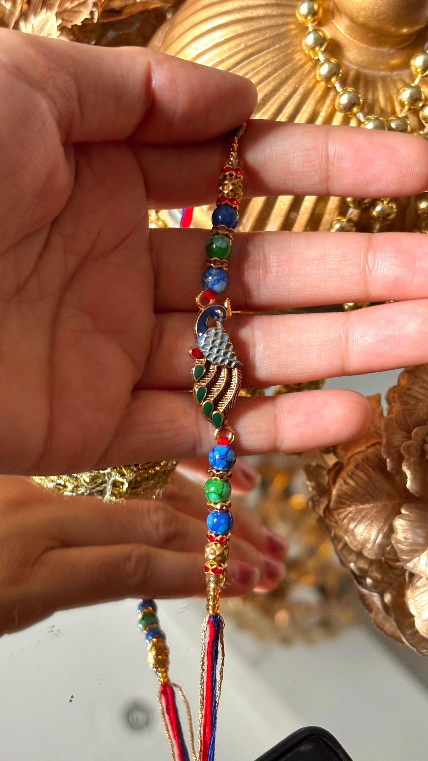 Peacock designer minimalist rakhi ( shipping will be extra )