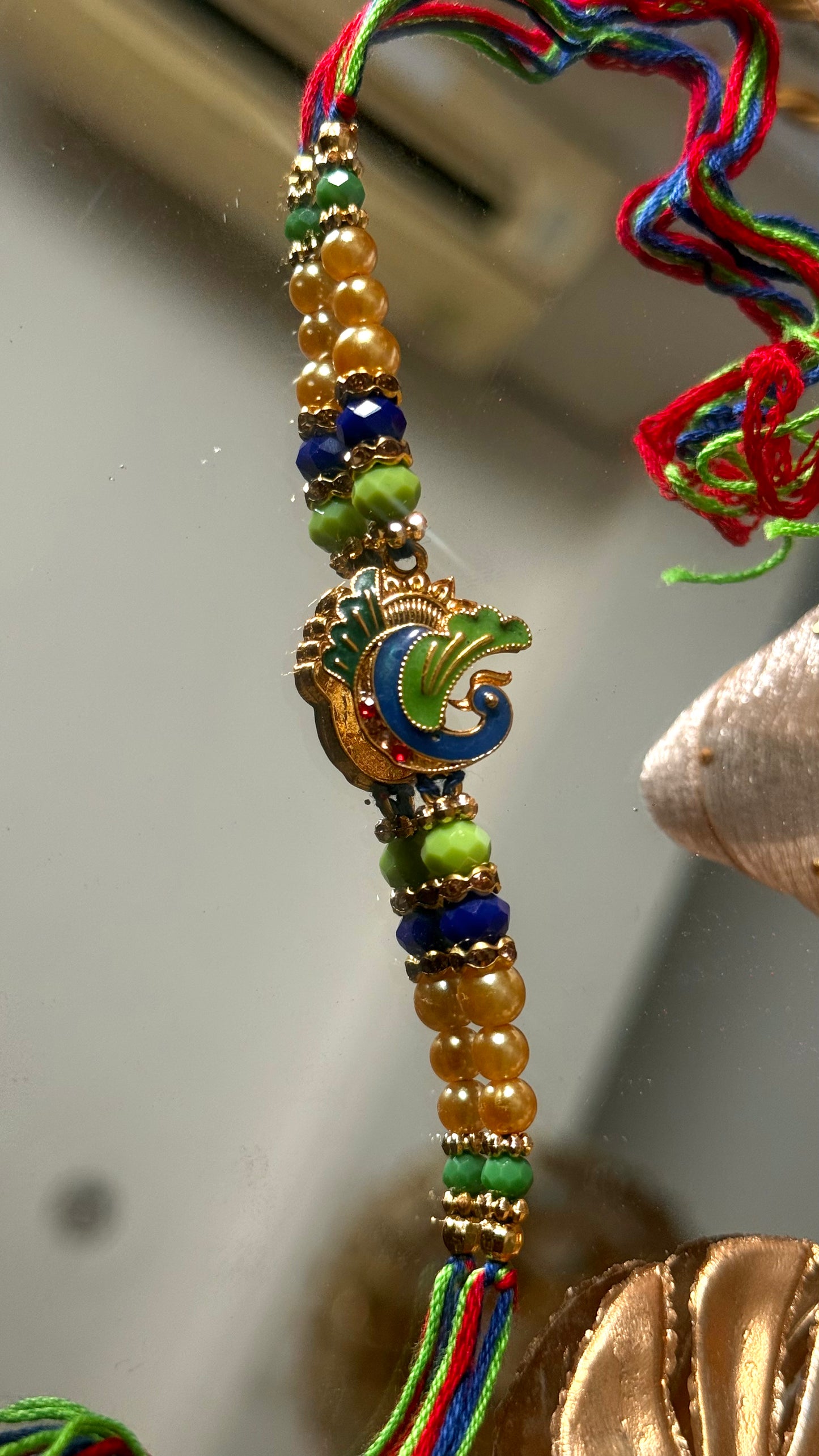 Peacock inspired nakashi rakhi