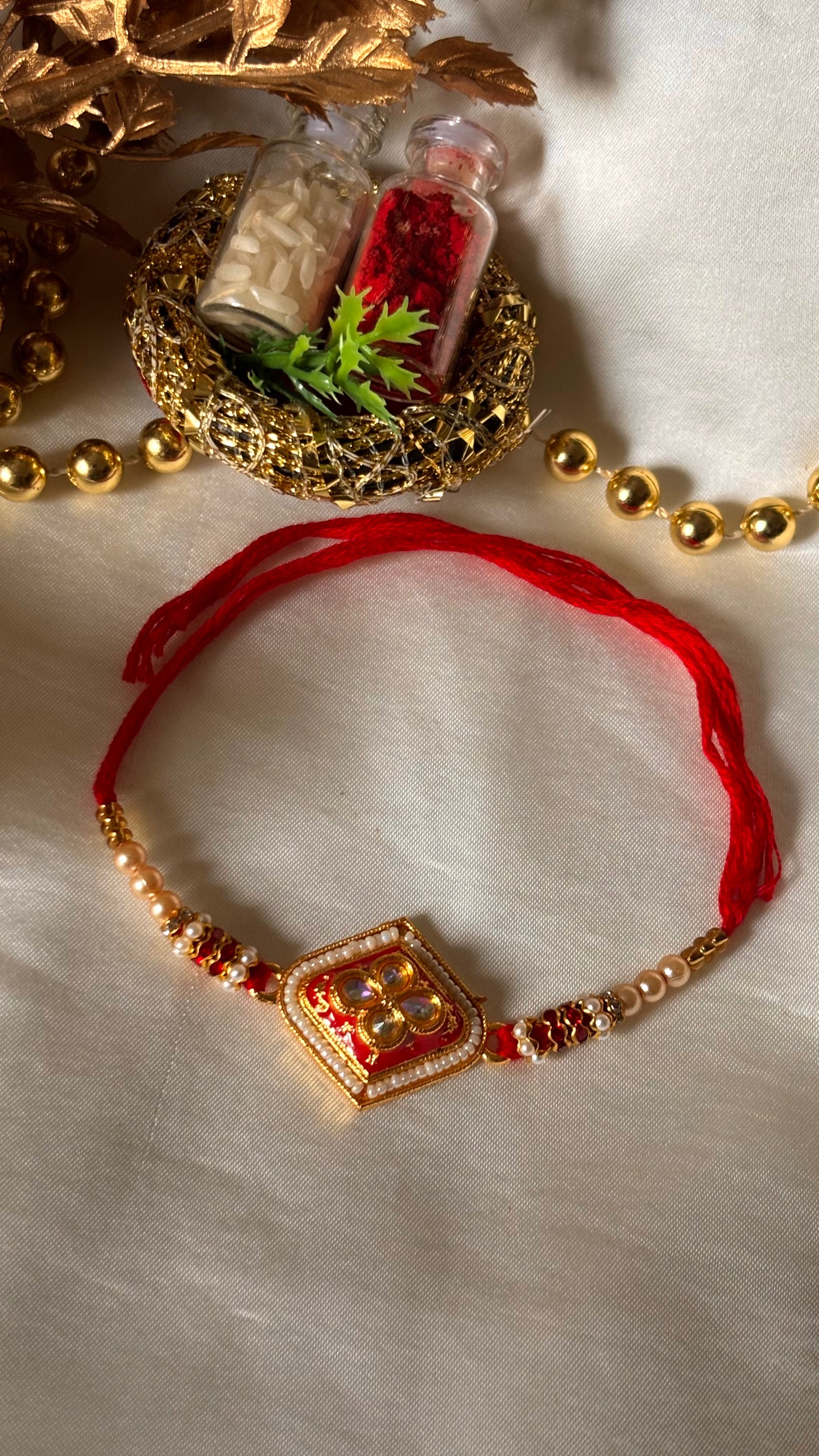 Red meenakari Kundan rakhi ( shipping will be extra )