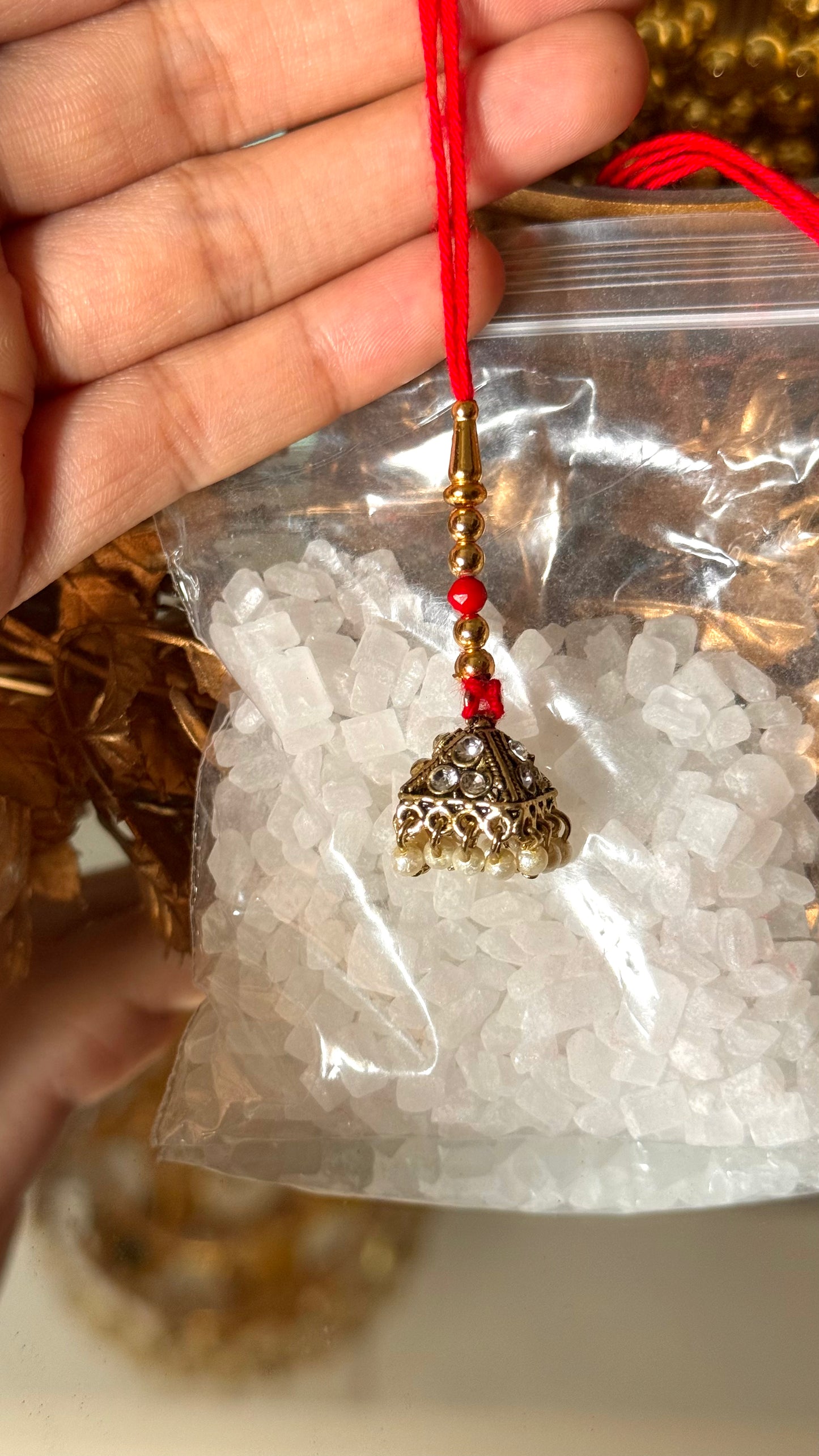 Gold jhumki rakhi
