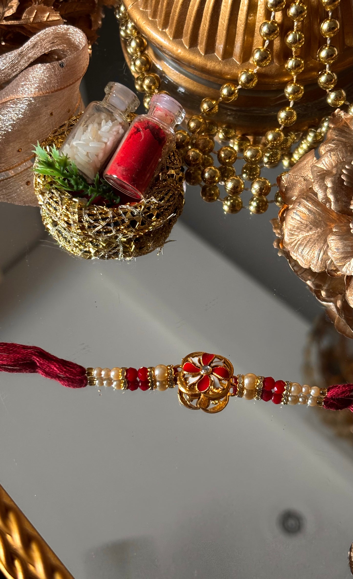 Ruby meenkaari pearl floral rakhi ( shipping will be extra )