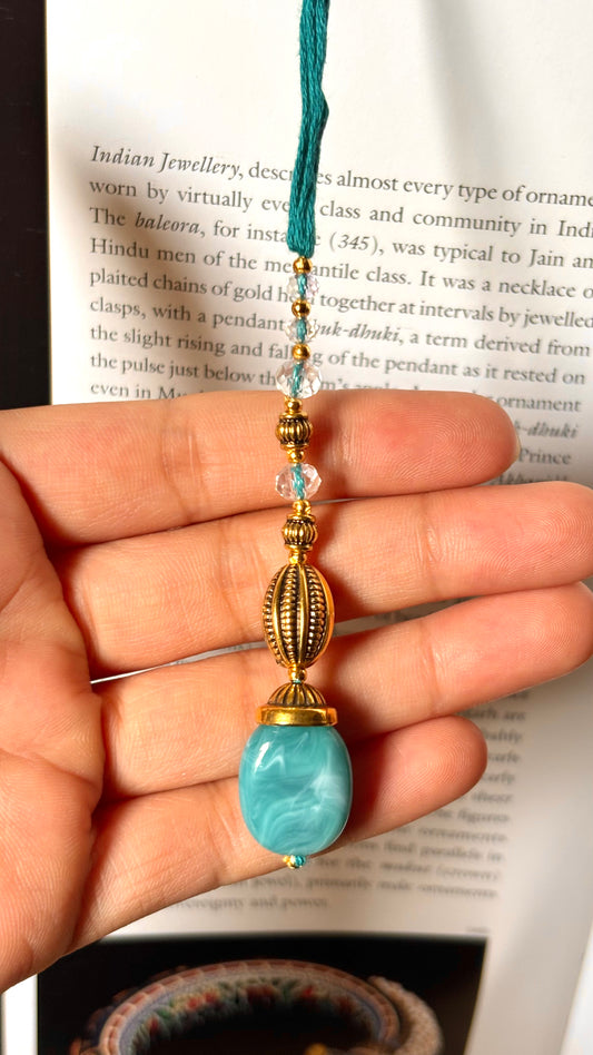 Powder blue lumba Rakhi(shipping will be extra)