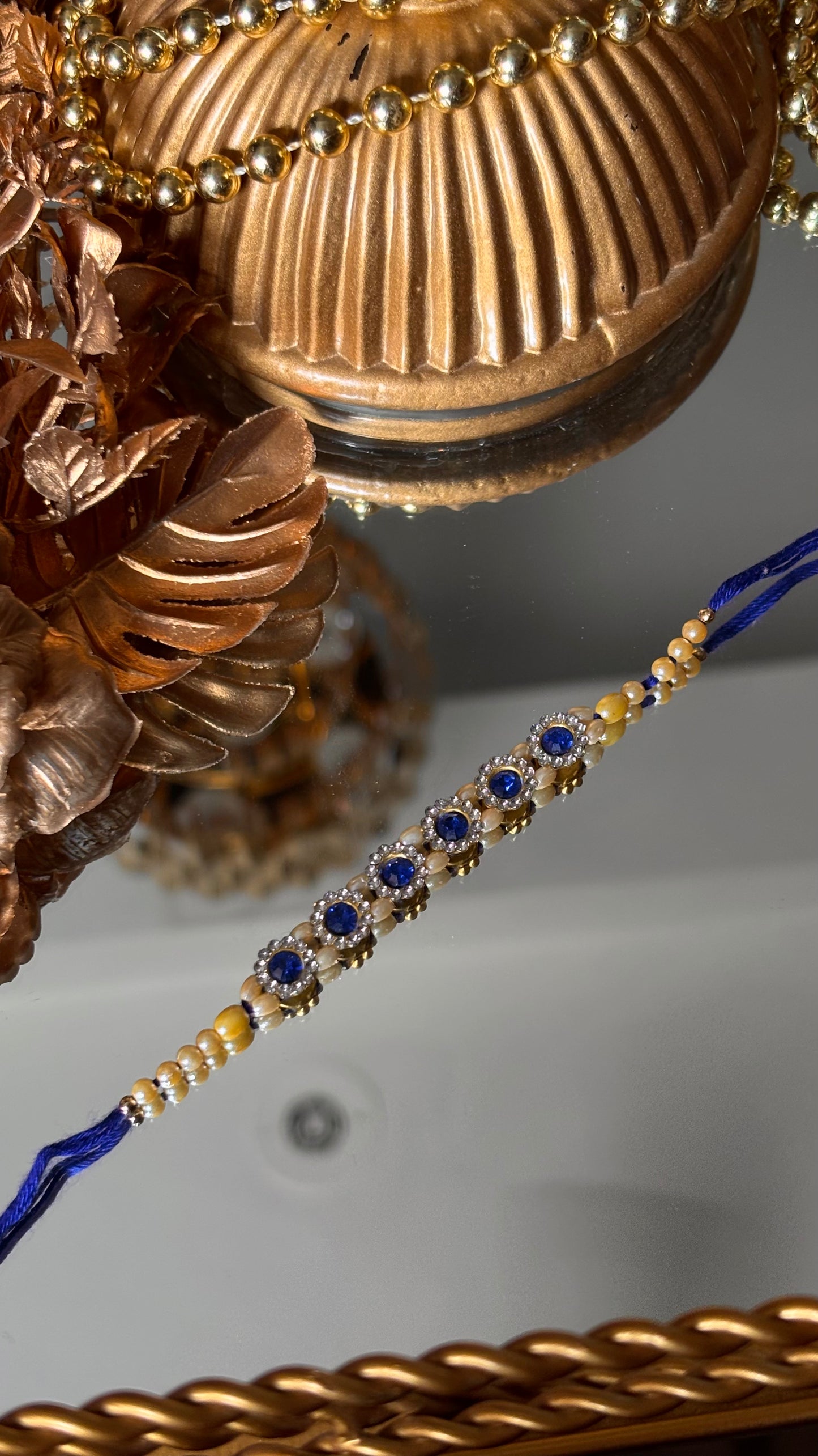 Sapphire stone rakhi ( shipping will be extra )