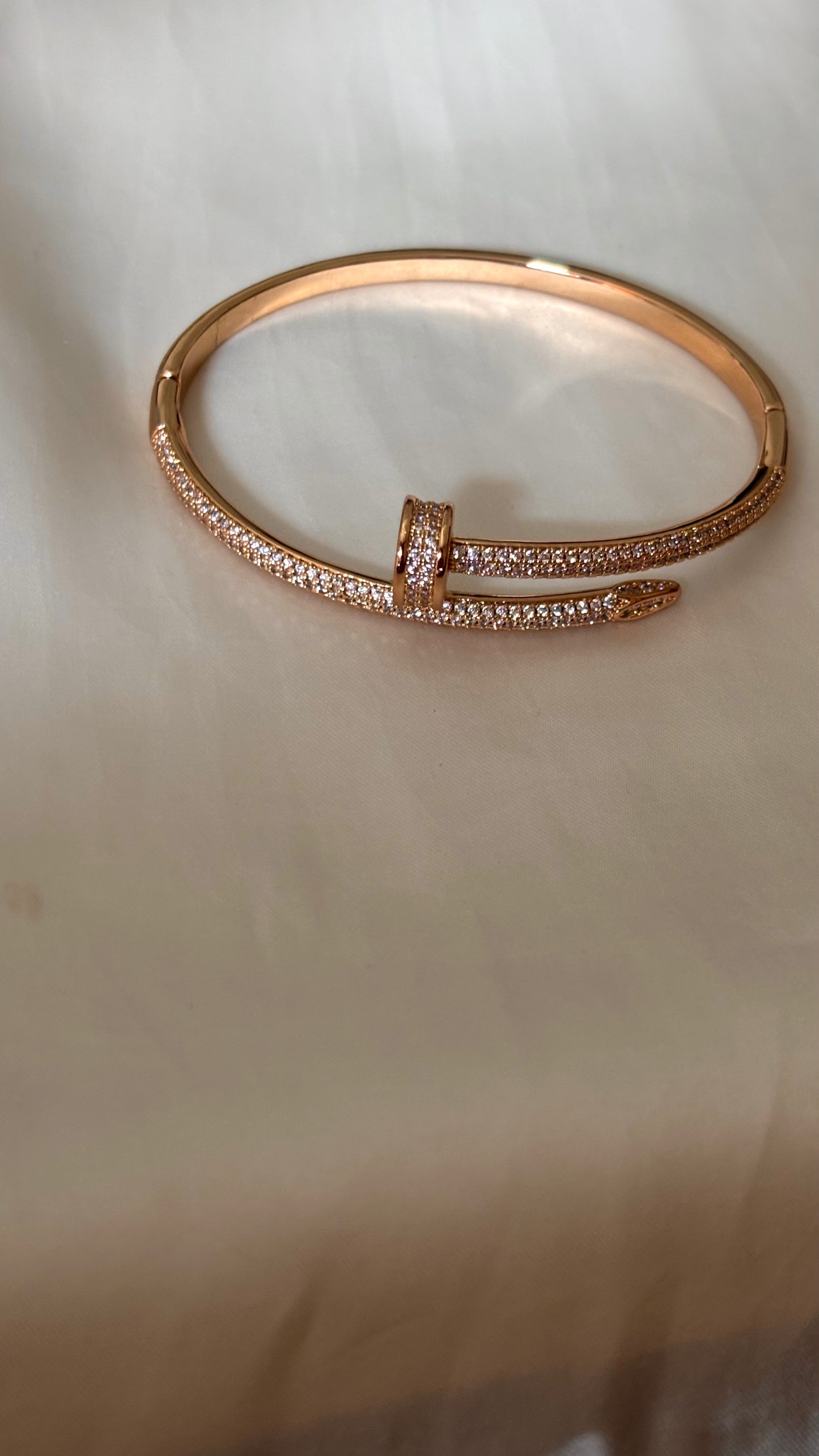 Crystal-Accented Nail rose gold tone bracelet