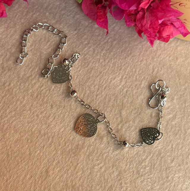 Rhodium triple heart bracelet