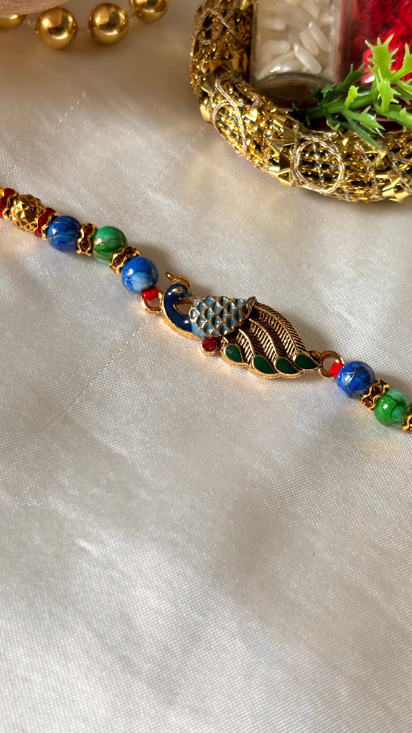 Peacock designer minimalist rakhi ( shipping will be extra )