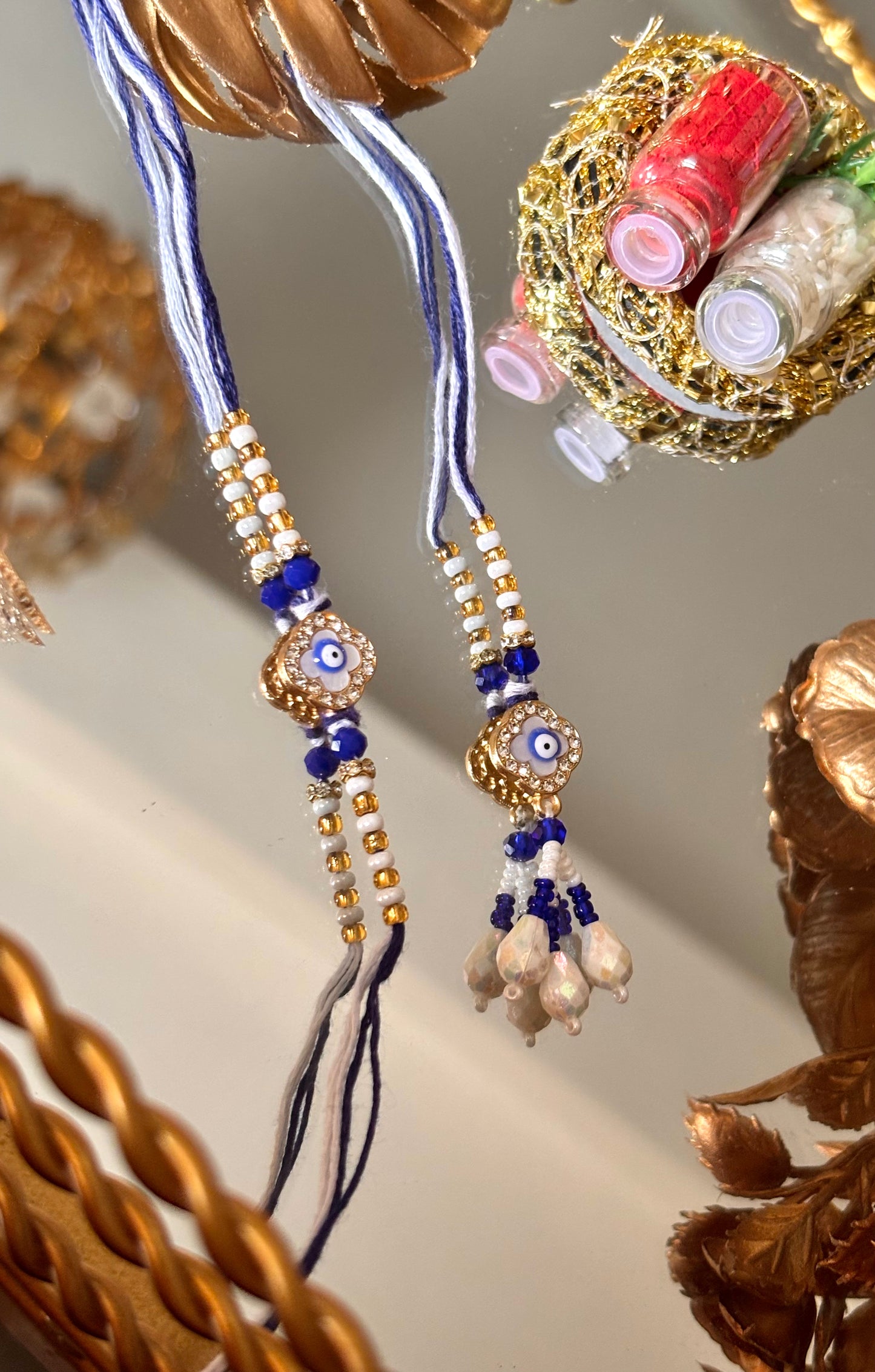 Evil eye vancleef inspired with pearl detailing couple rakhi ( shipping will be extra )