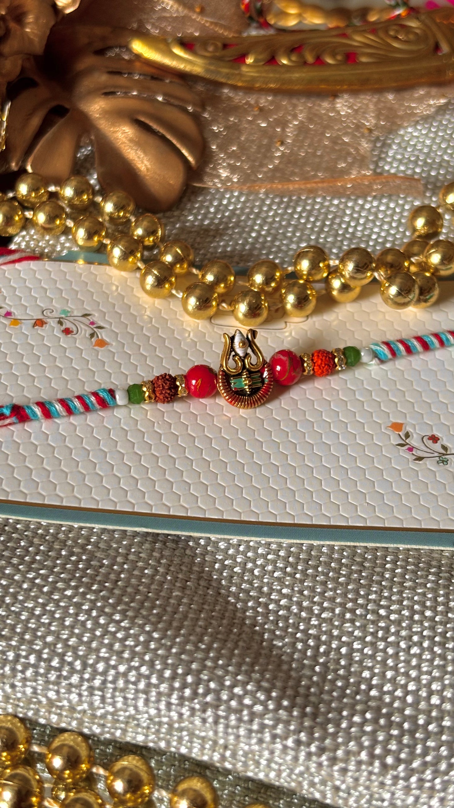 Lord shiva inspired rudraksh rakhi (red&blue) (shipping will be extra)