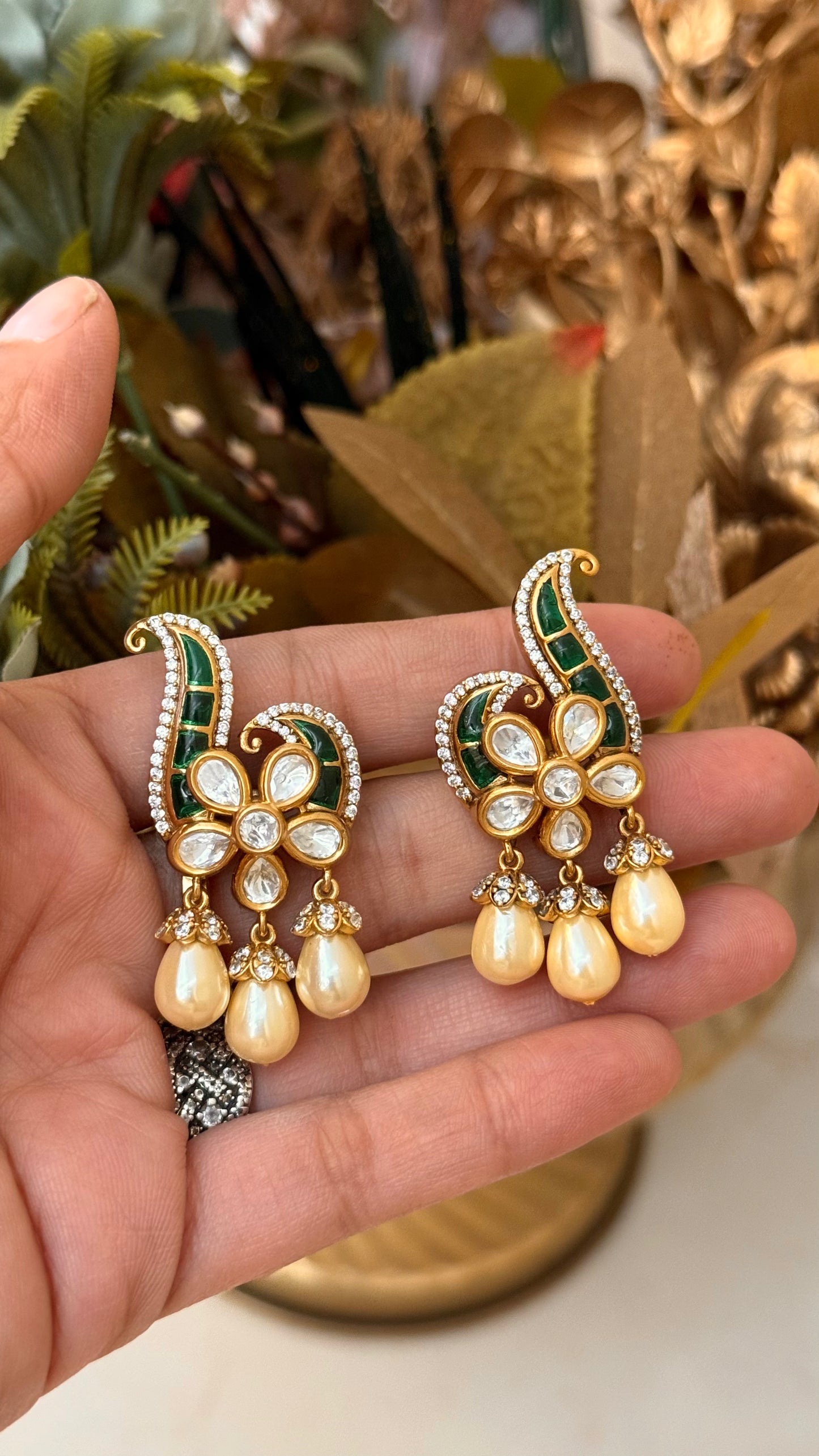 Designer emerald takkar studs with floral pearl detailing