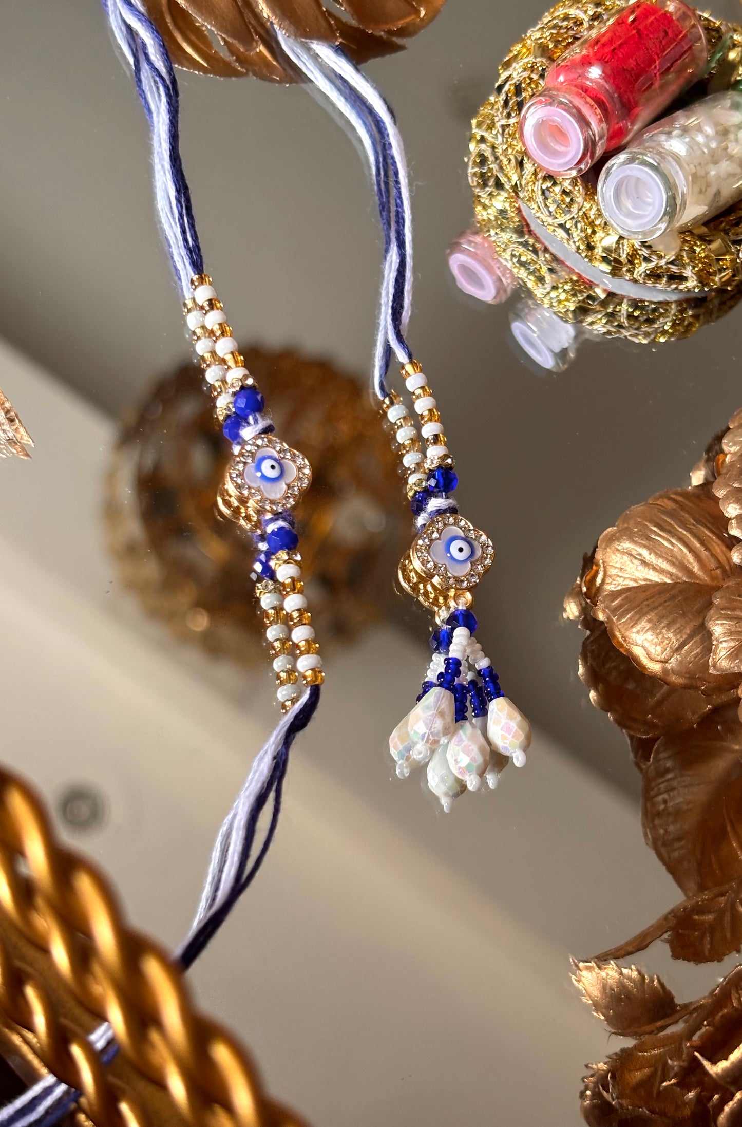 Evil eye vancleef inspired with pearl detailing couple rakhi ( shipping will be extra )