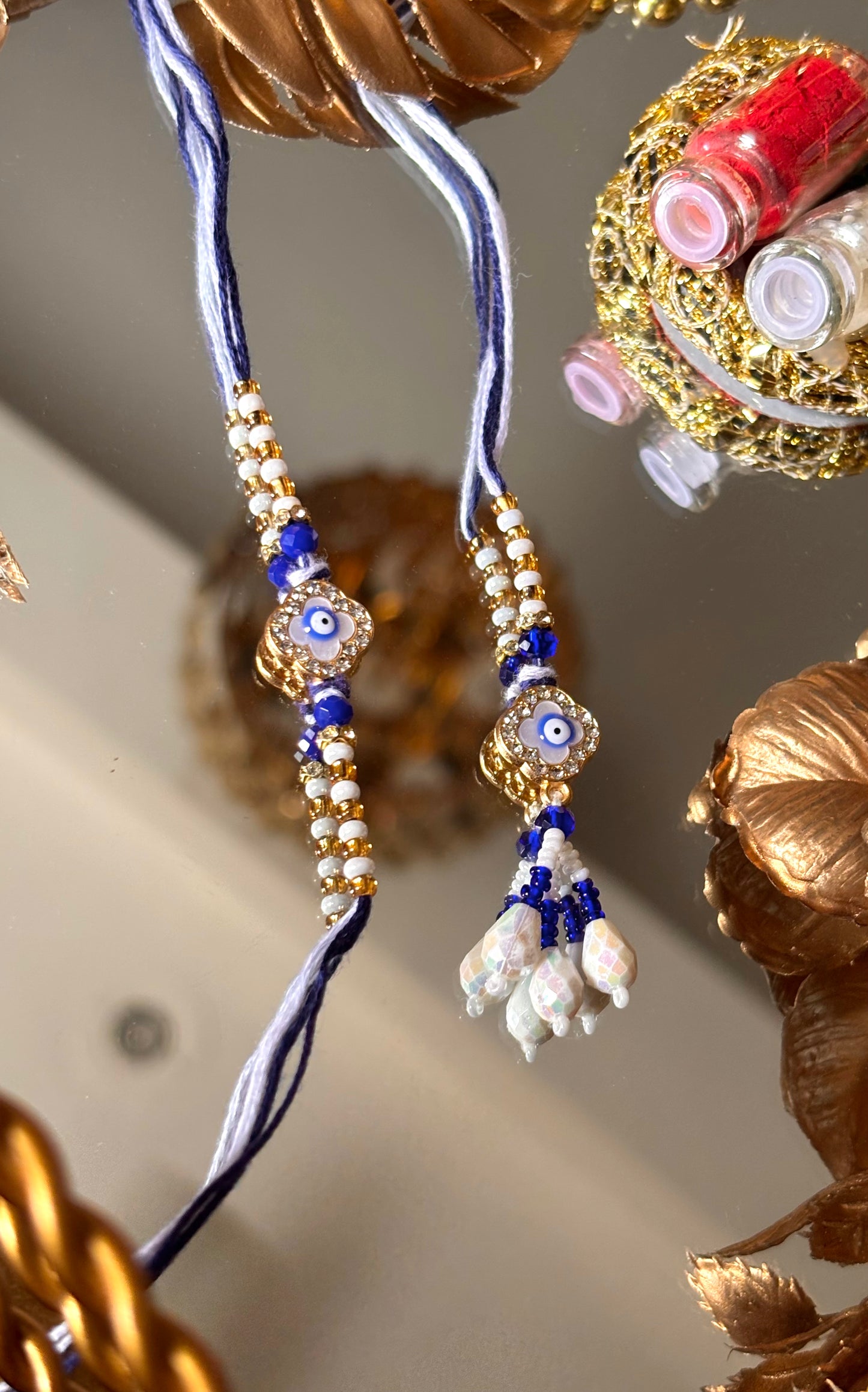 Evil eye vancleef inspired with pearl detailing couple rakhi ( shipping will be extra )