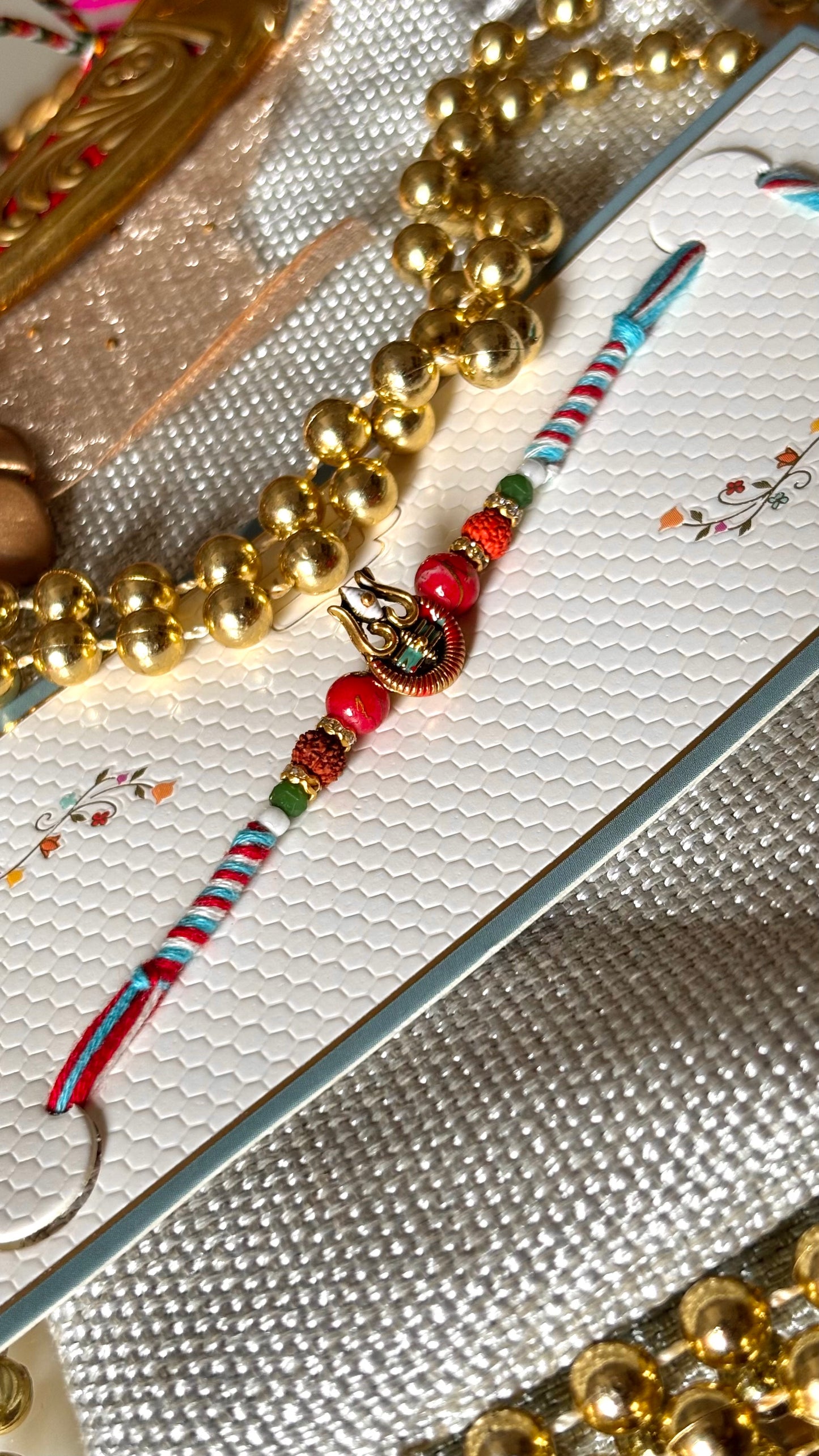 Lord shiva inspired rudraksh rakhi (red&blue) (shipping will be extra)