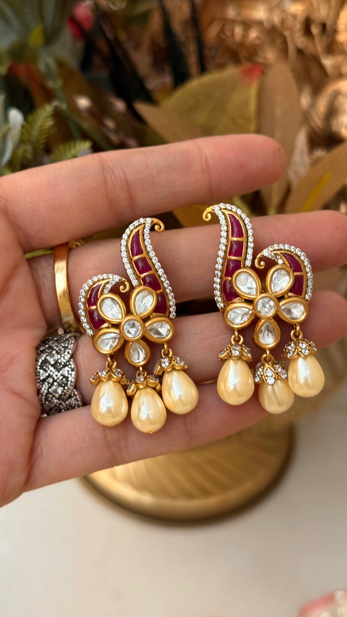 Designer Ruby takkar studs with floral pearl detailing