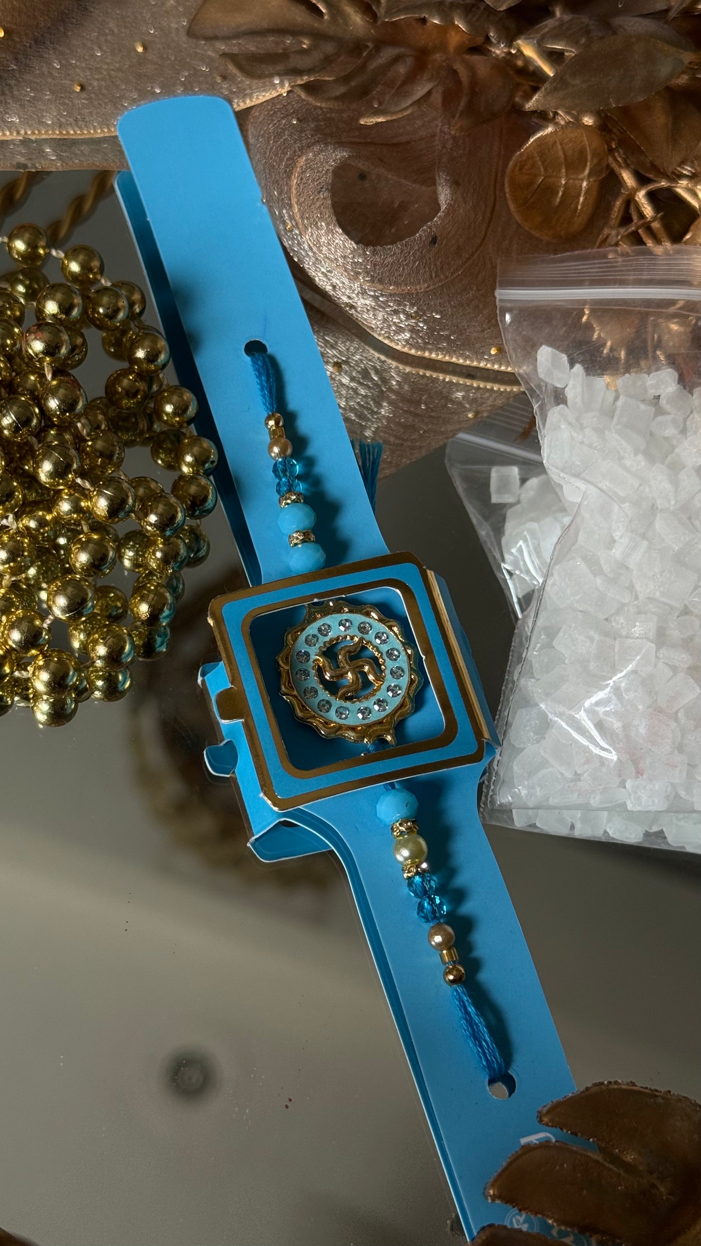 Swastik Rakhi (sapphire)