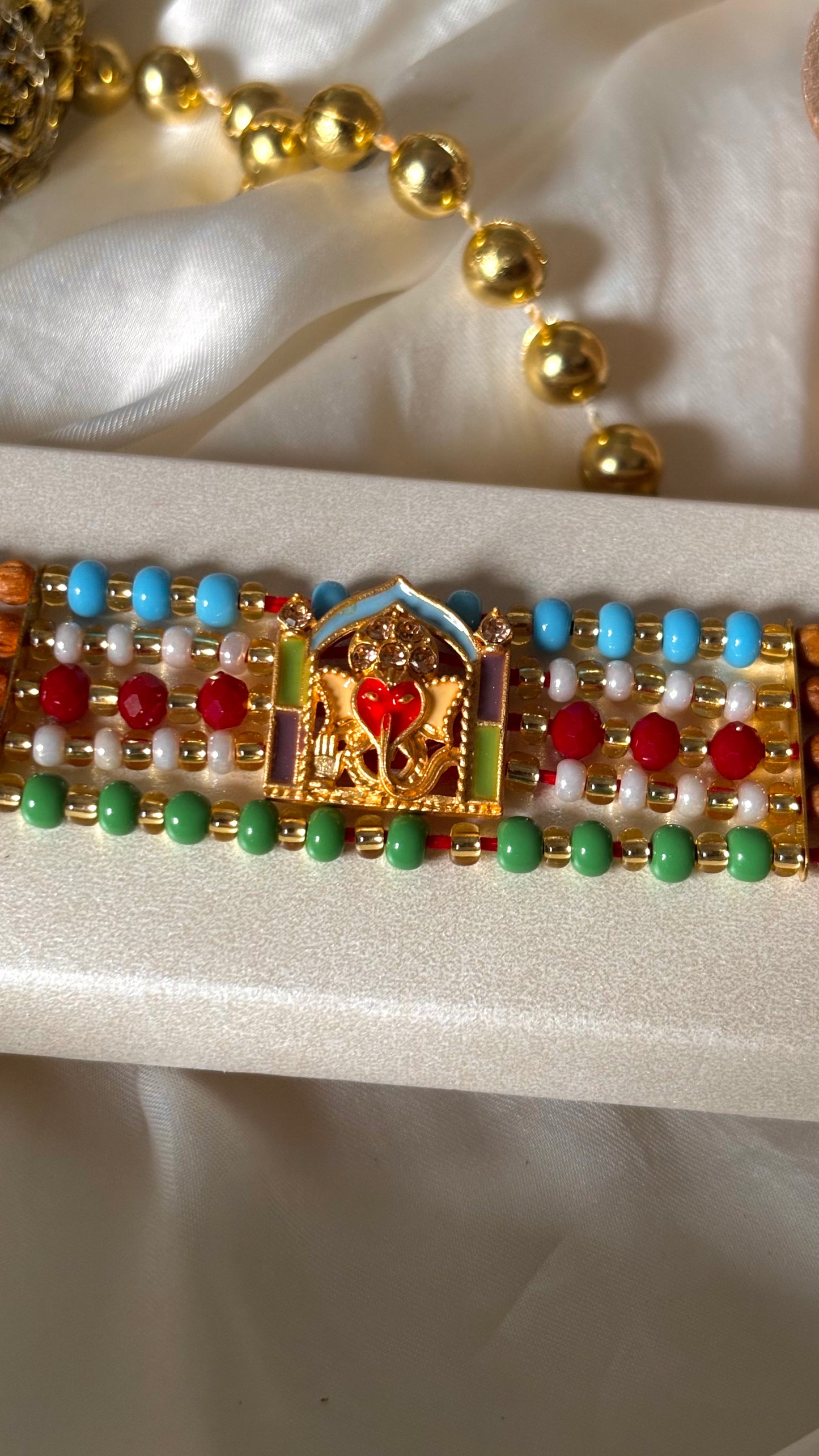 Lord ganesha multicoloured rakhi ( shipping will be extra )