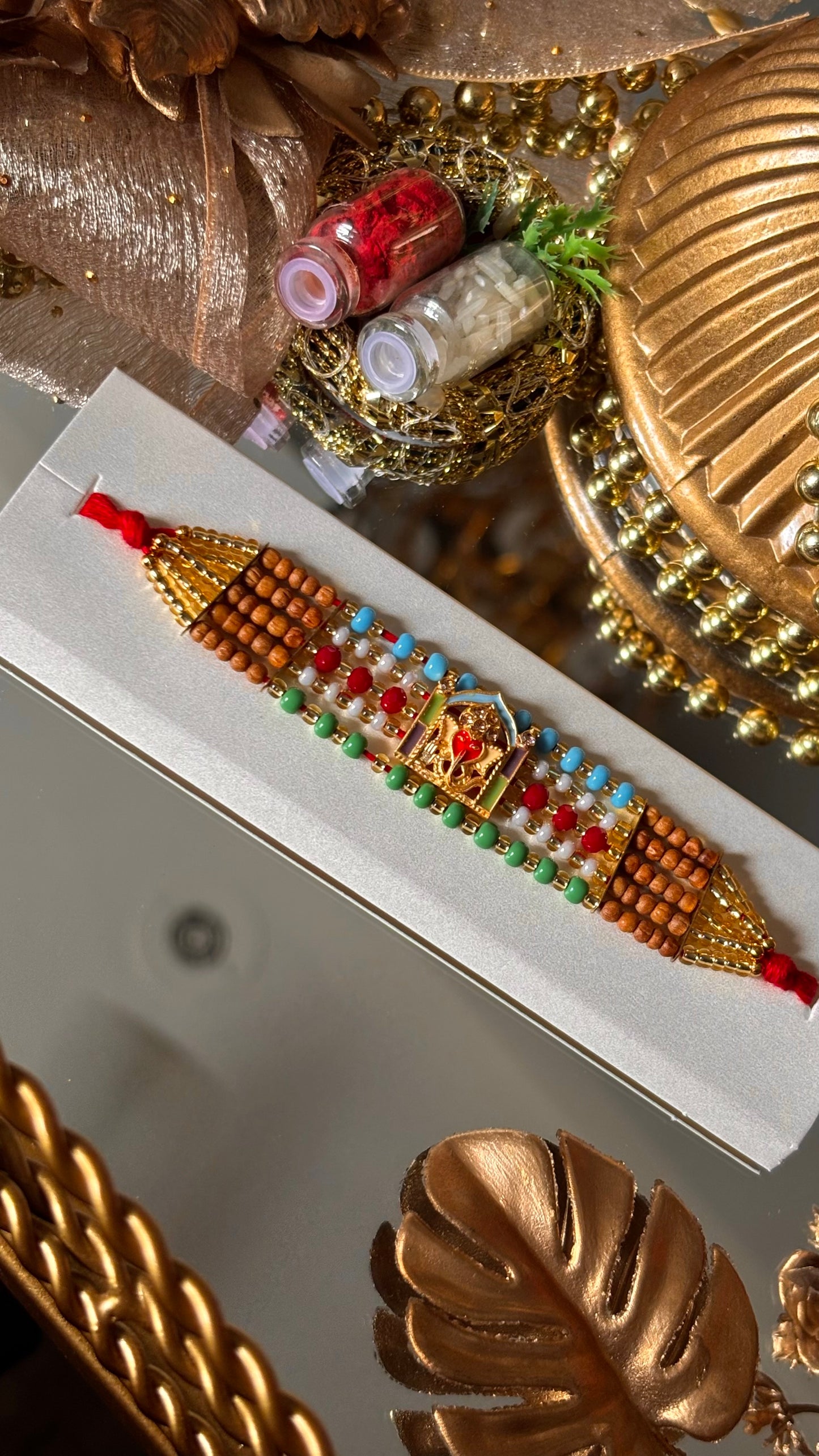 Lord ganesha multicoloured rakhi ( shipping will be extra )