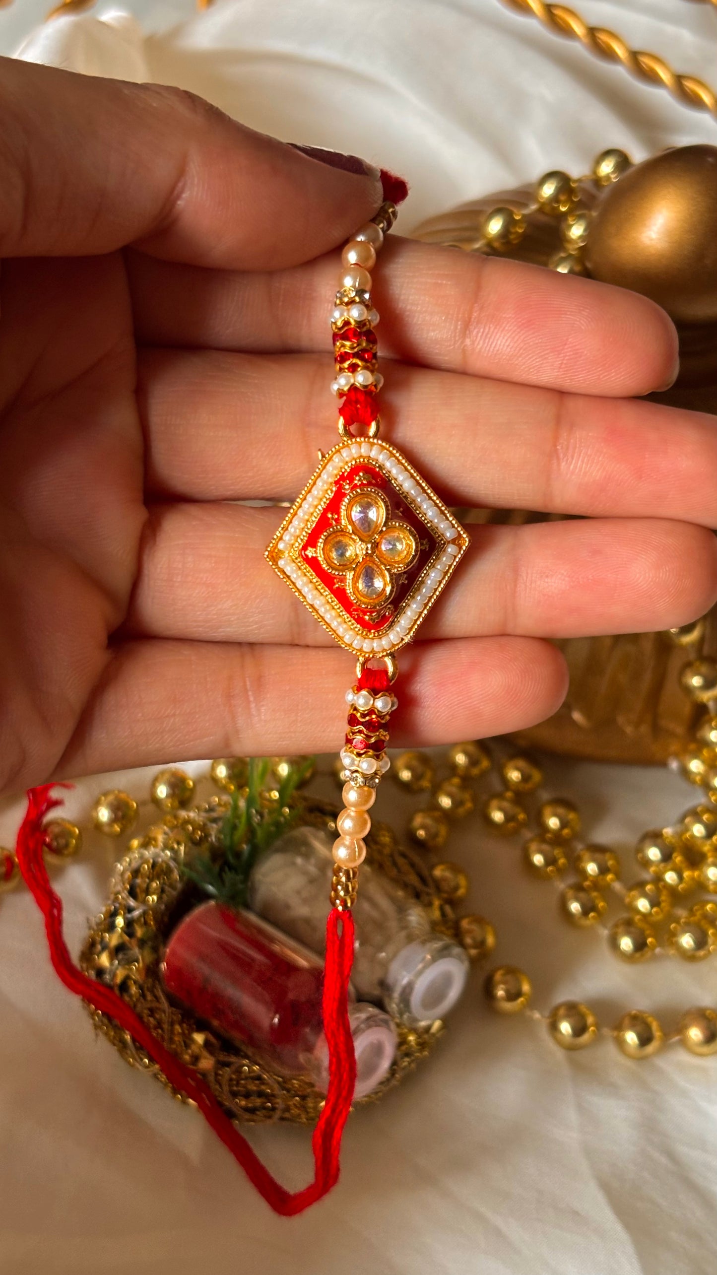 Red meenakari Kundan rakhi ( shipping will be extra )