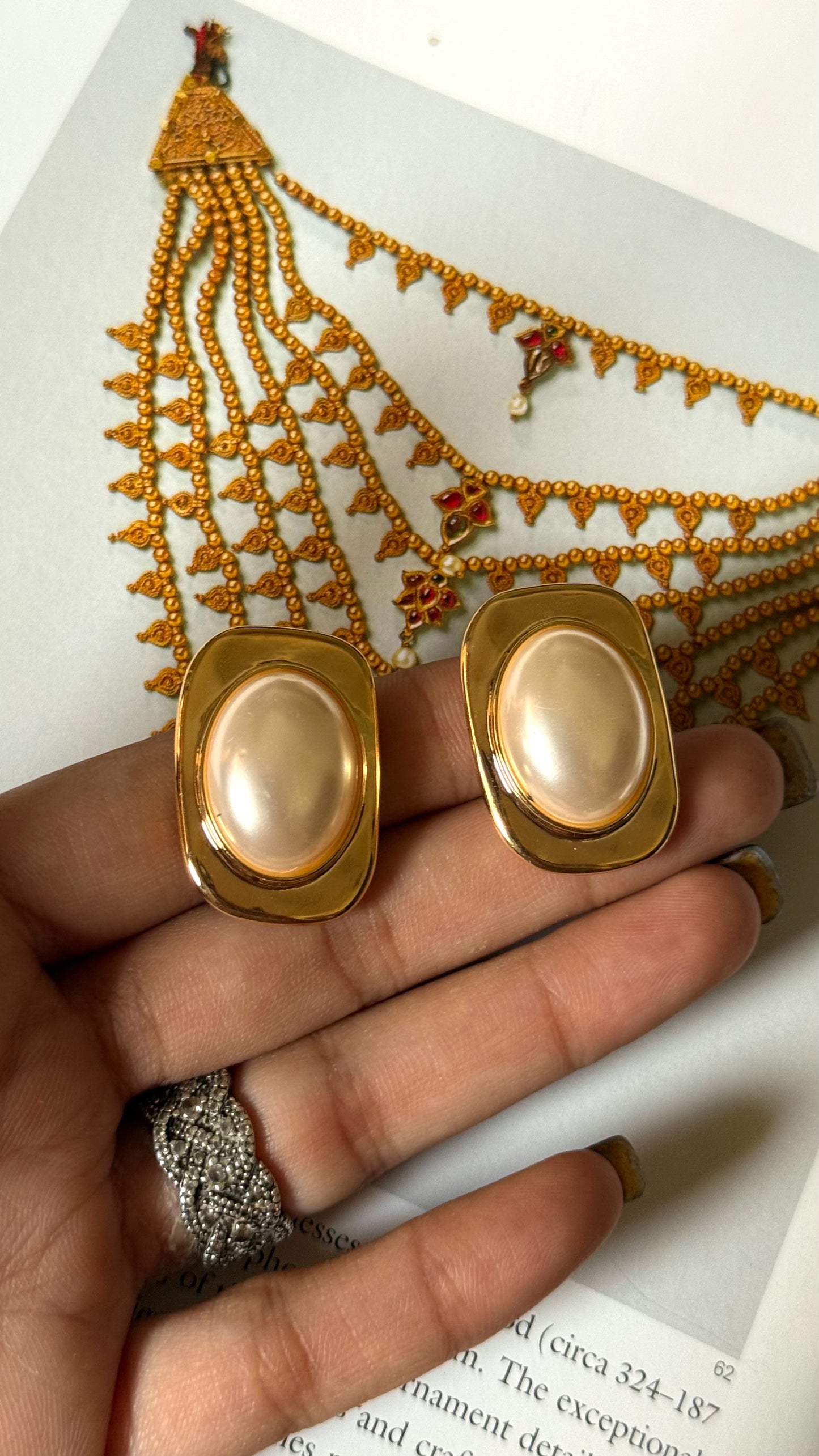 Off white & golden studs