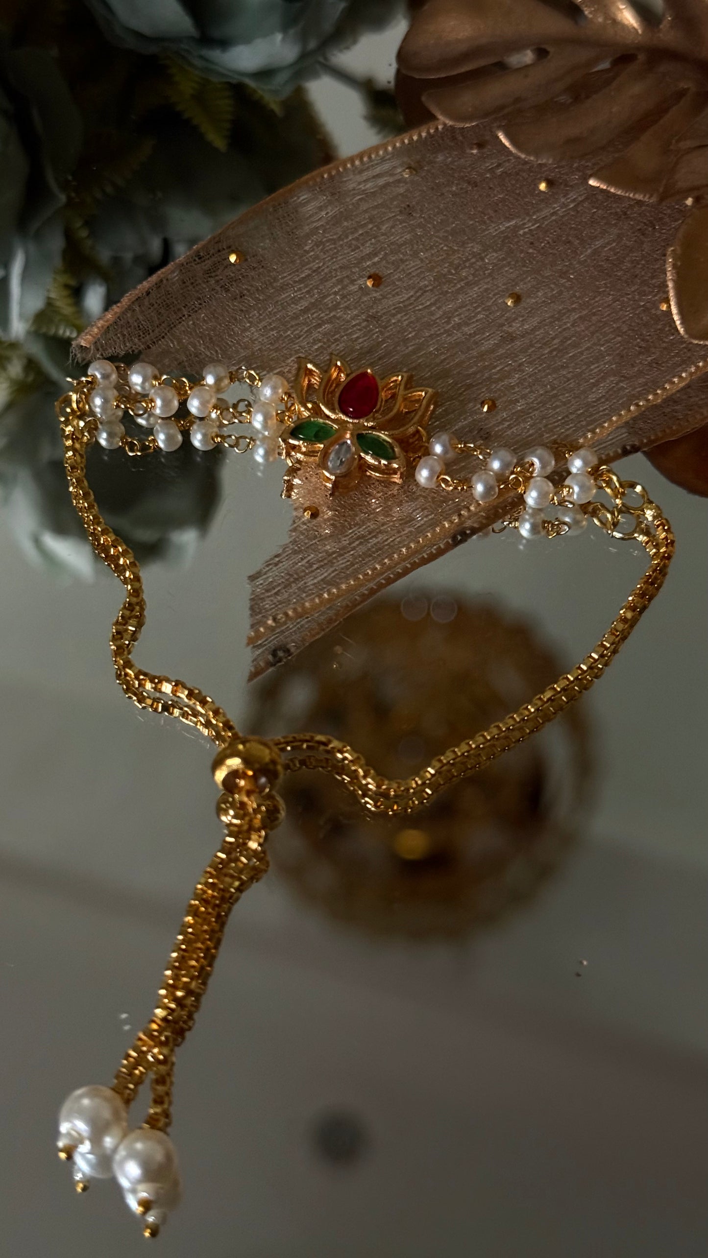Ruby & emerald lotus inspired Rakhi (shipping will be extra )