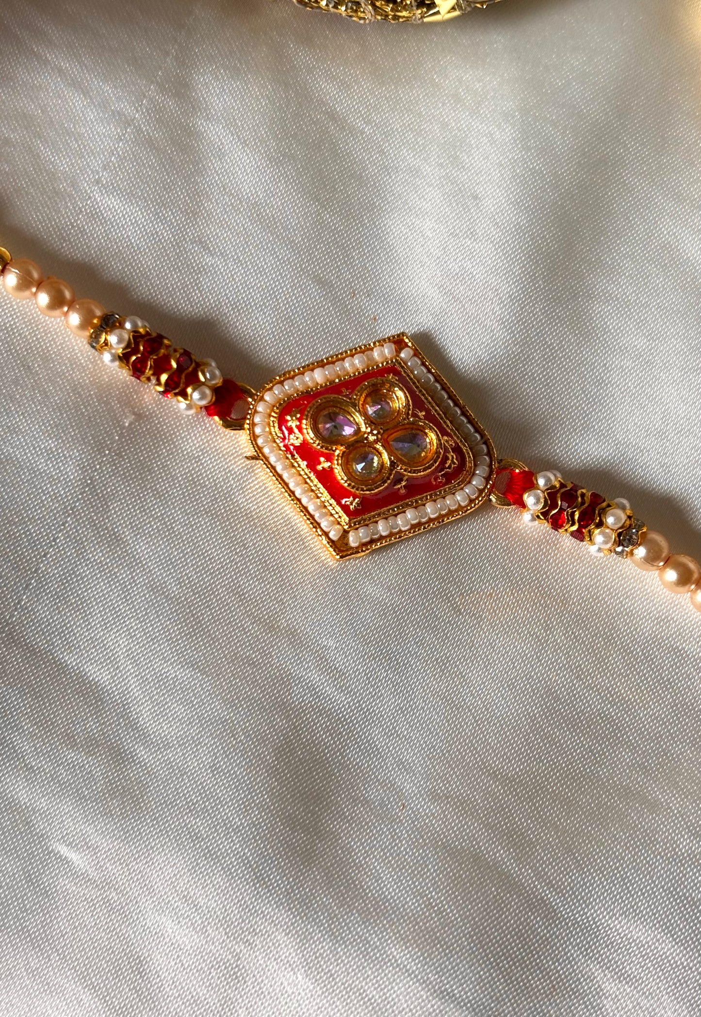 Red meenakari Kundan rakhi ( shipping will be extra )