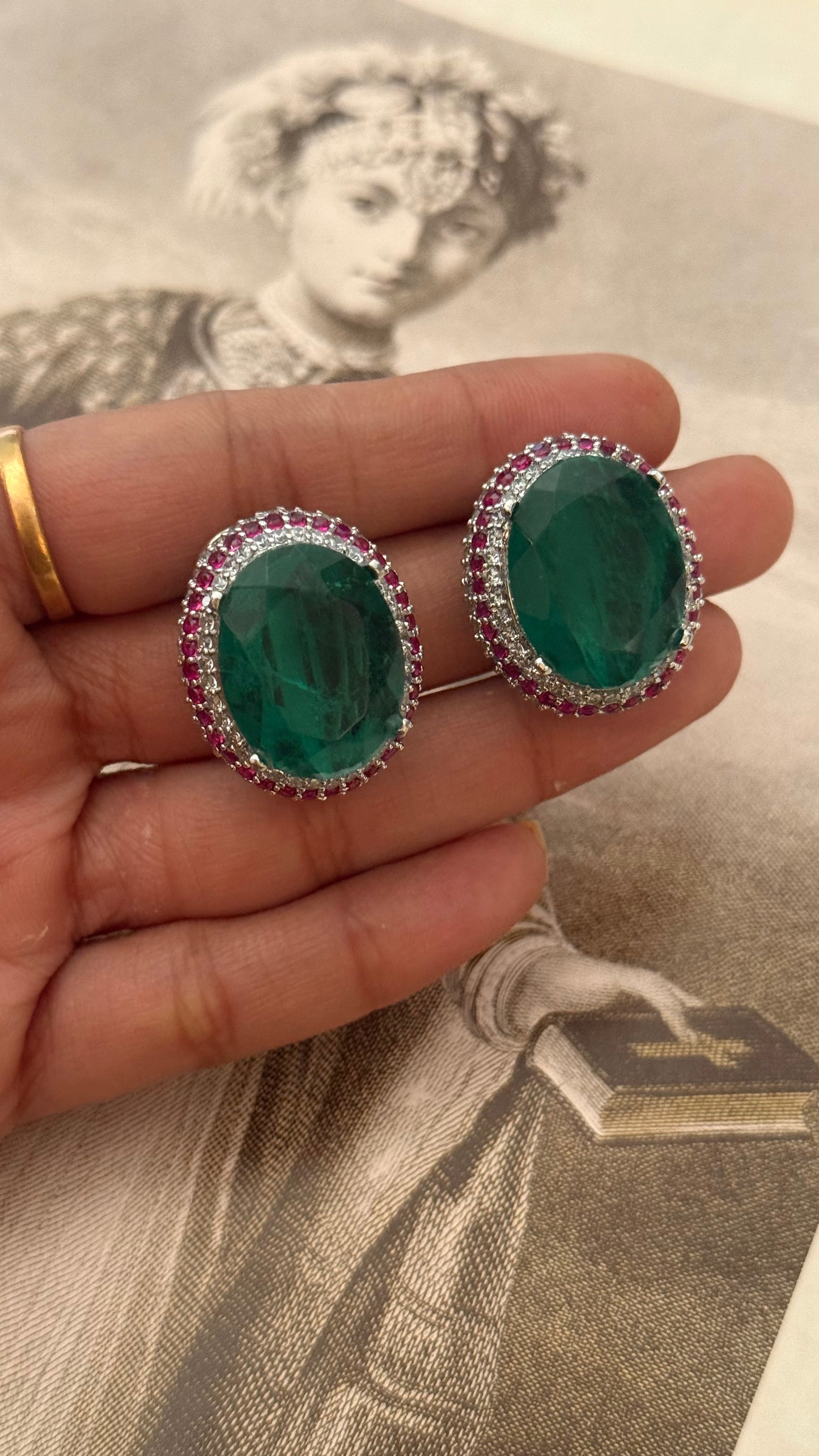 Emerald studs with ruby lining (Silver polish)