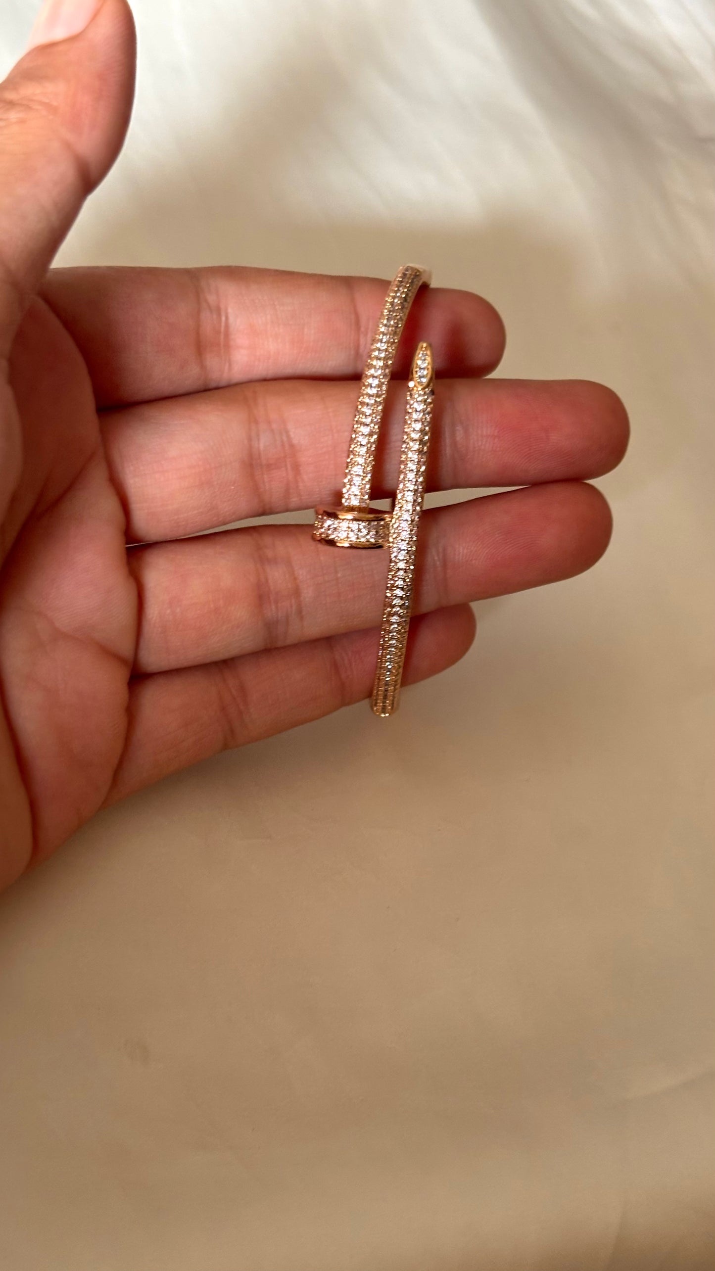 Crystal-Accented Nail rose gold tone bracelet