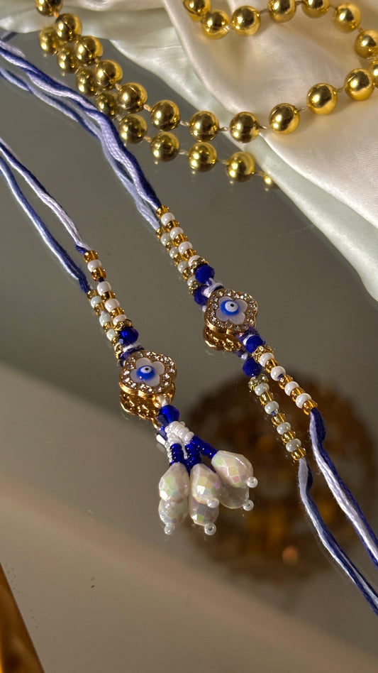 Evil eye vancleef inspired with pearl detailing couple rakhi ( shipping will be extra )