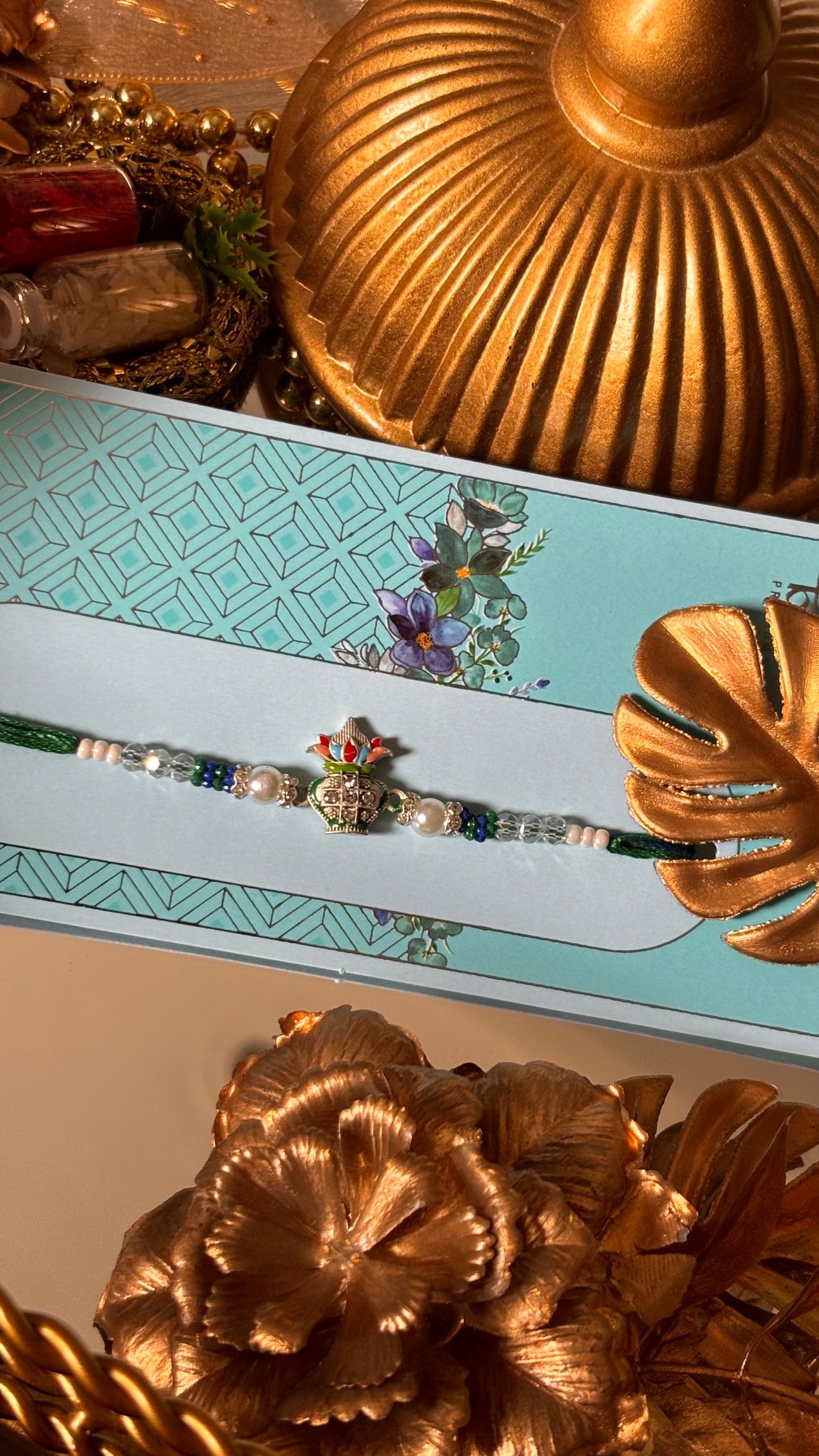 Kalash with pearl detailing rakhi ( shipping will be extra )