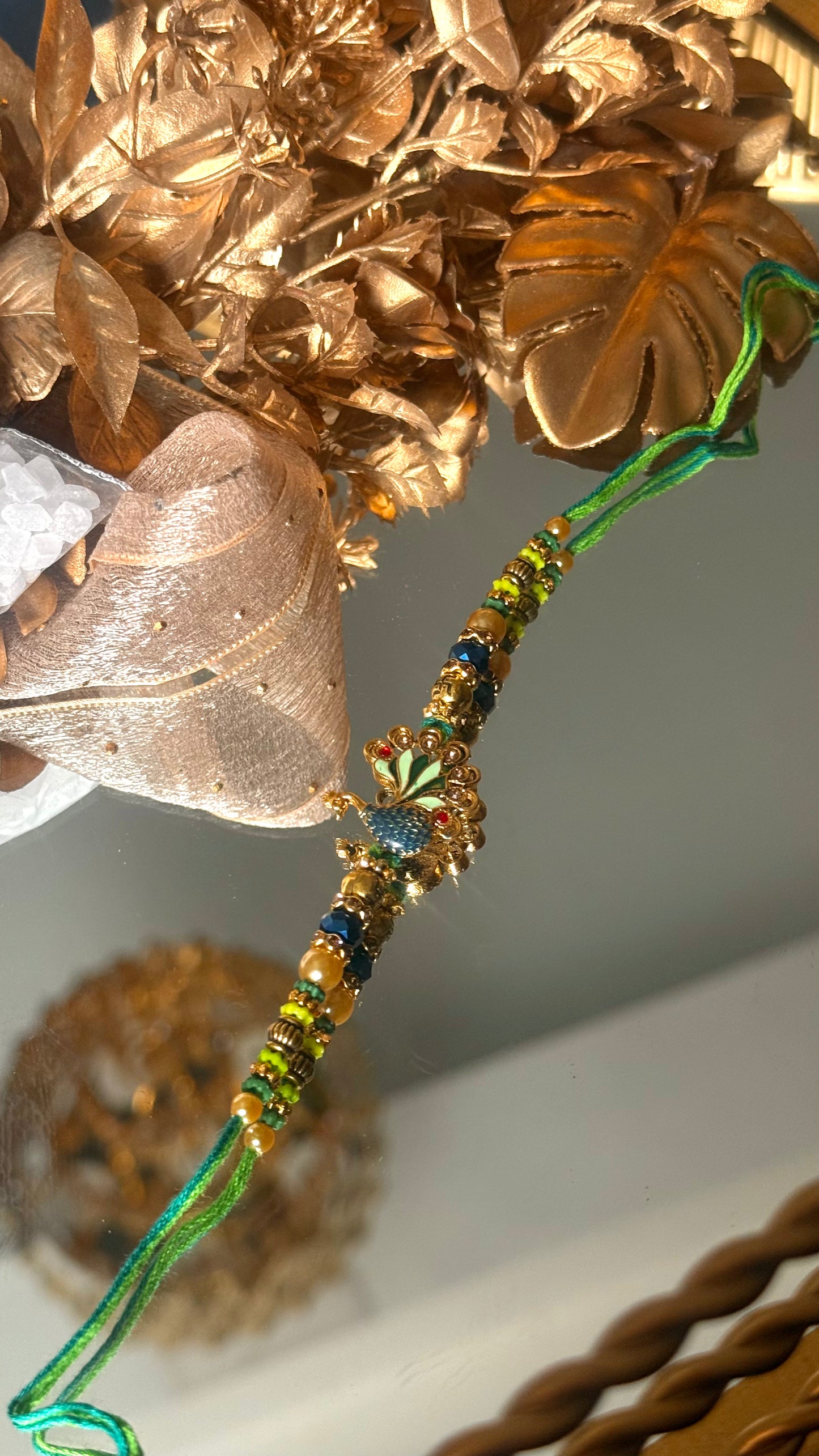 Peacock inspired nakashi rakhi