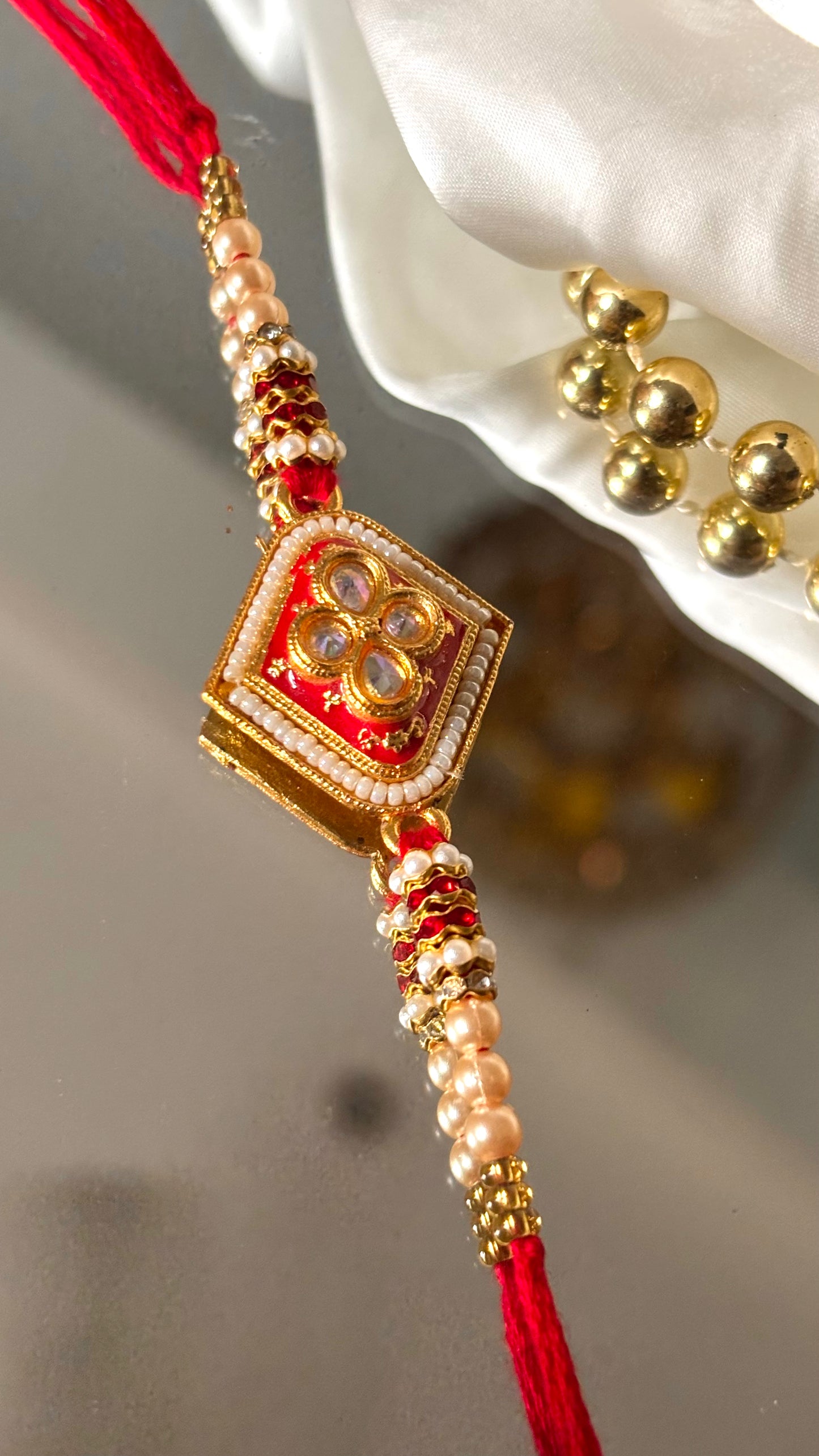 Red meenakari Kundan rakhi ( shipping will be extra )