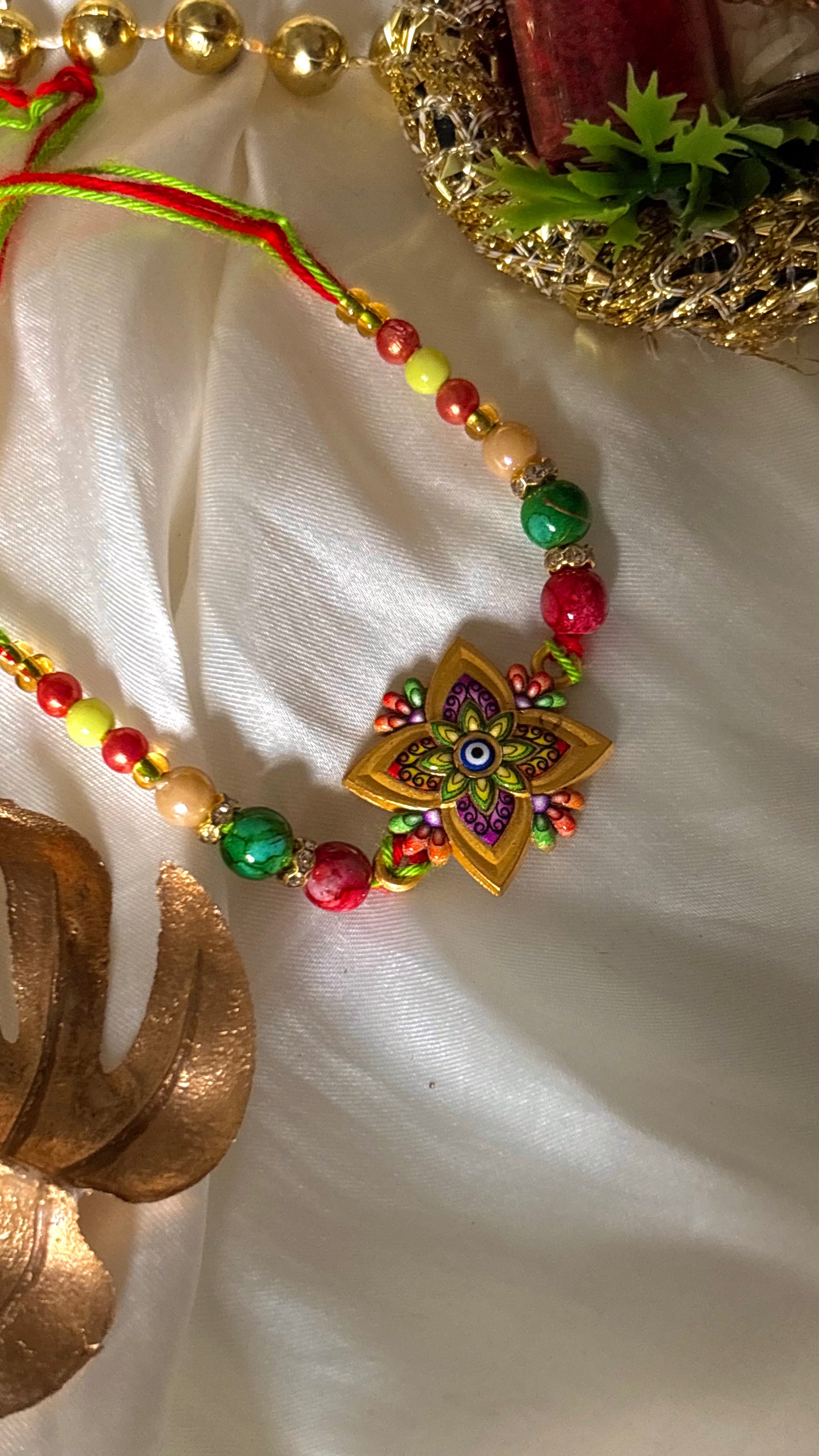 Multicoloured evil eye meenakari nakashi minimalist Rakhi ( shipping will be extra )