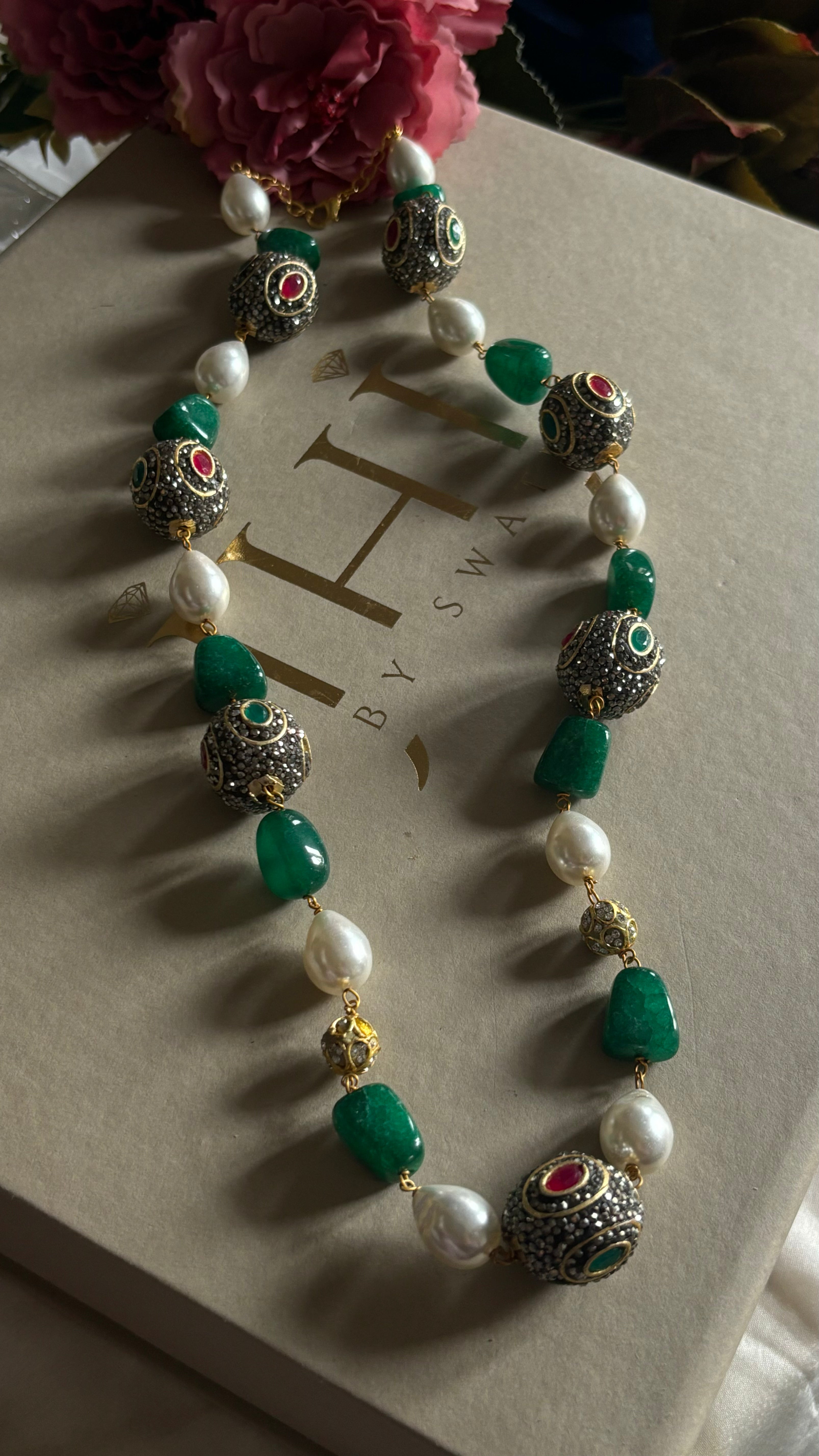 Emerald pearl and ruby string