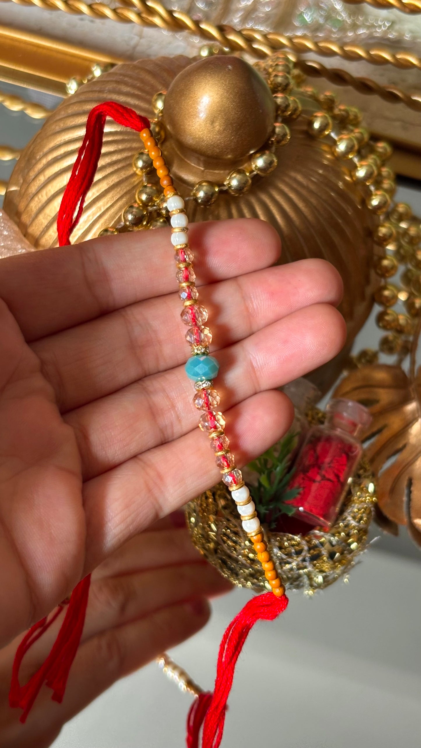 Firoza thread rakhi (shipping will be extra )