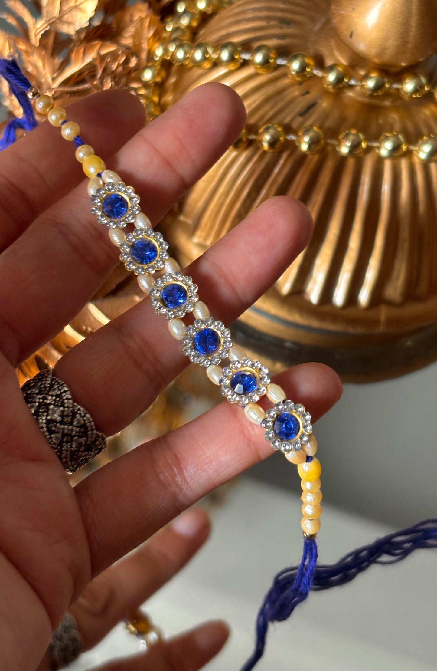 Sapphire stone rakhi ( shipping will be extra )