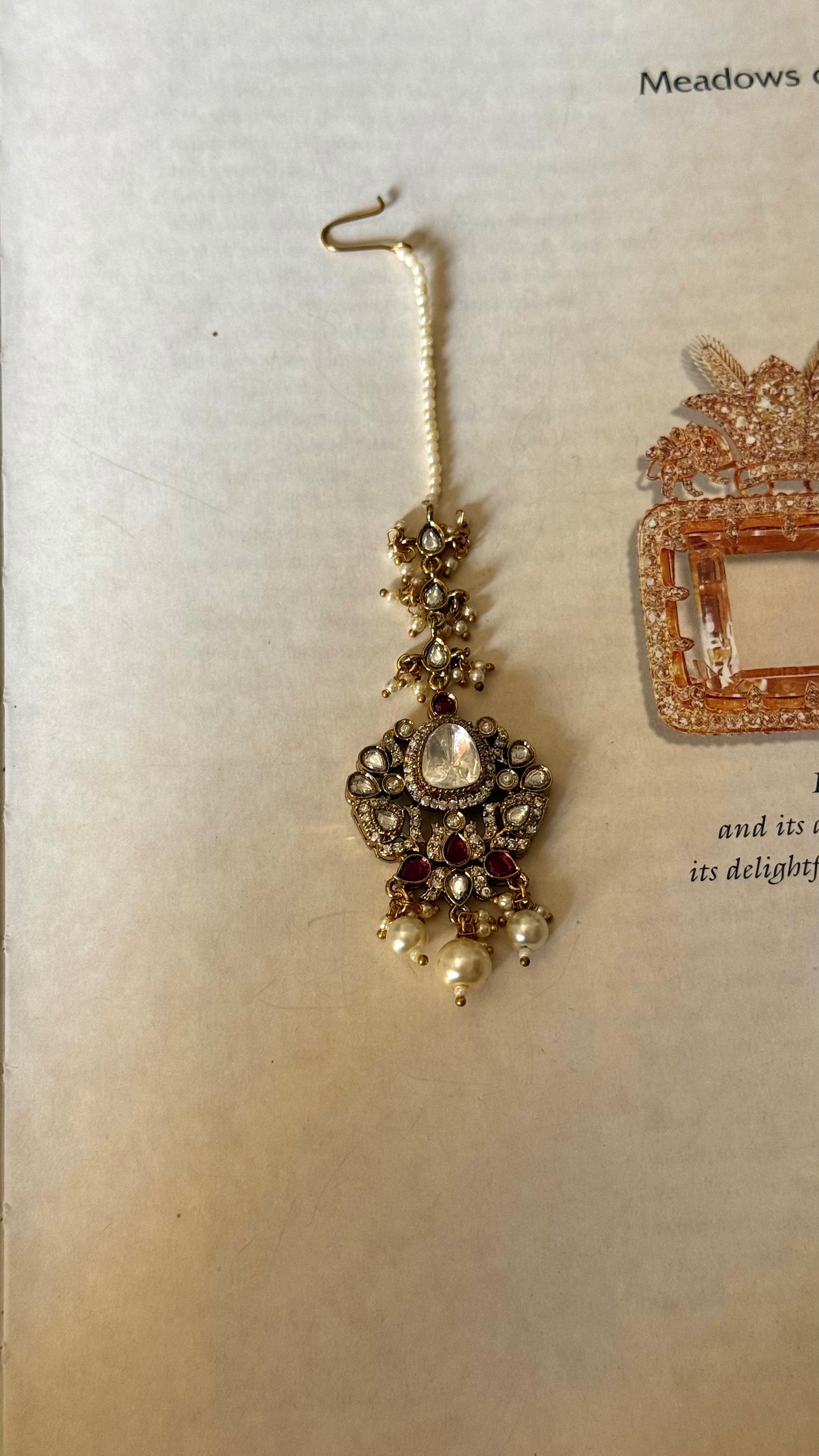 Tear shaped polki with pearl drop detailing maangtikka